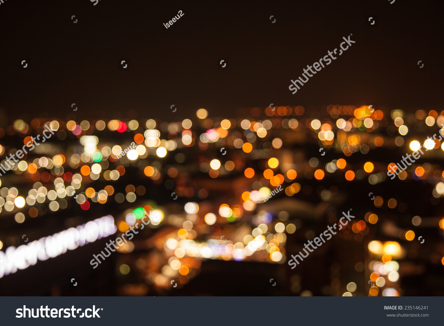 defocused bokeh of light in city on yellow background