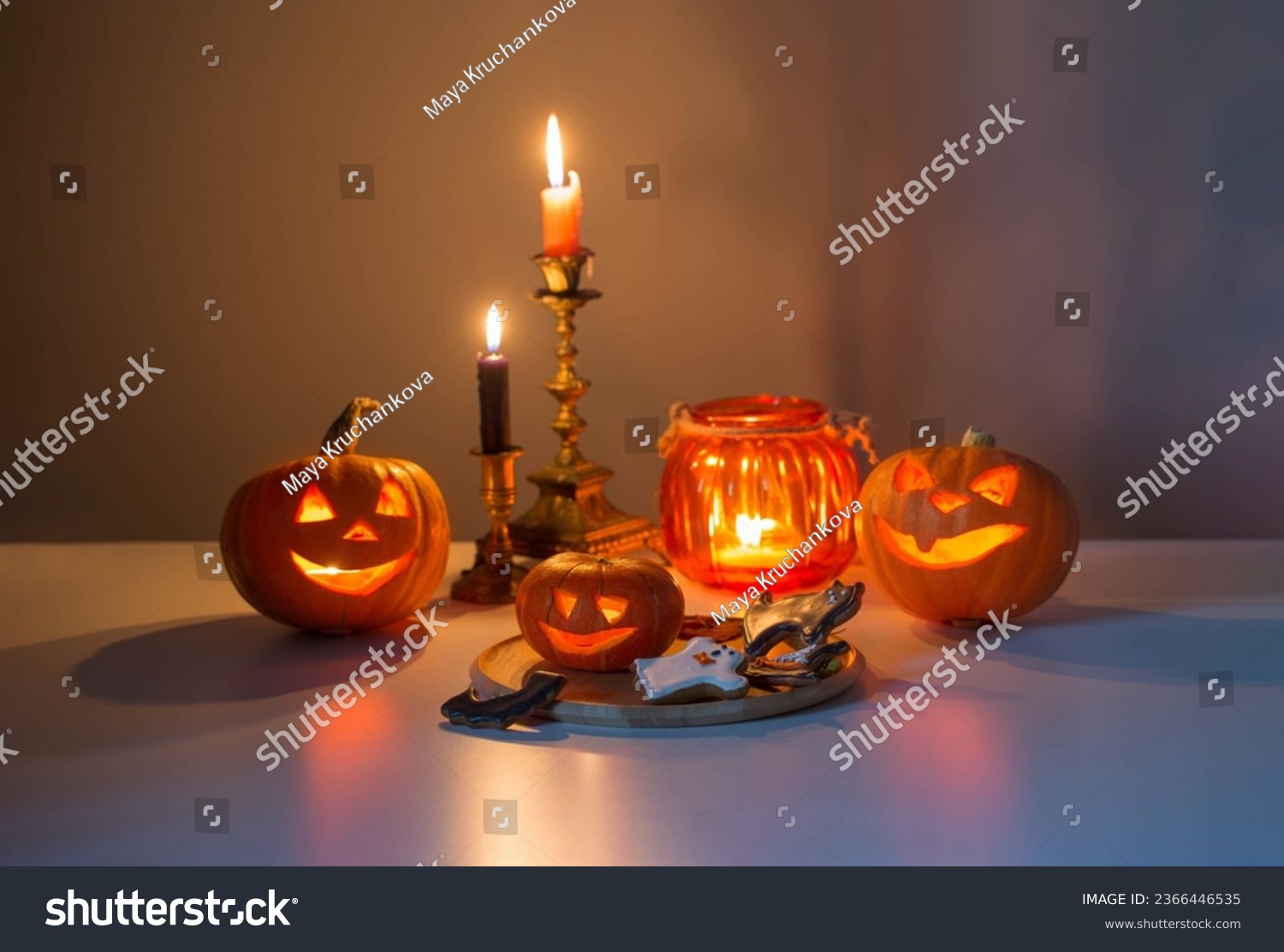 halloween pumpkins with burning candles on white table_站酷海洛_正版图片_视频_字体 ...