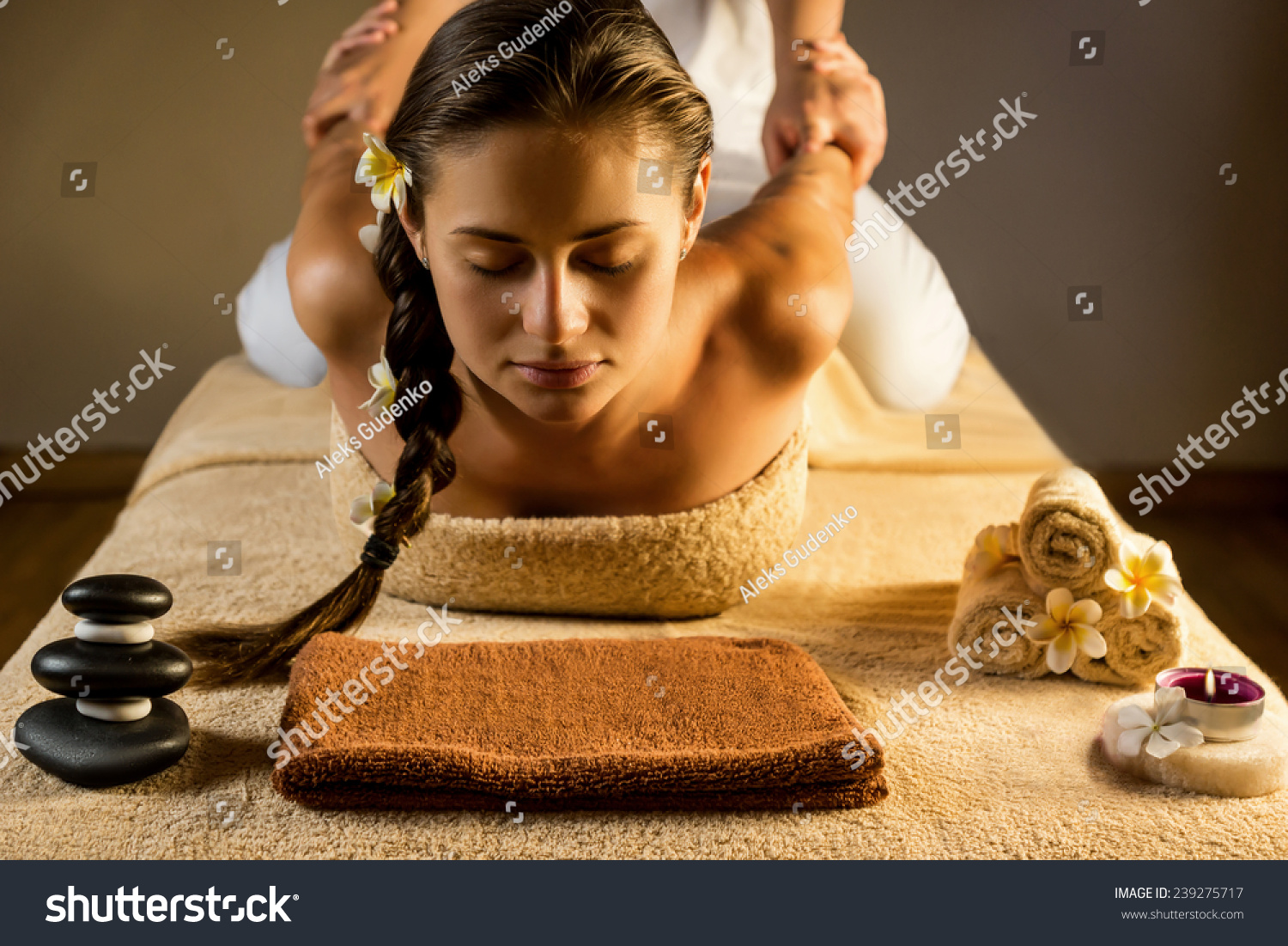 The beautiful girl has massage. Stretching.