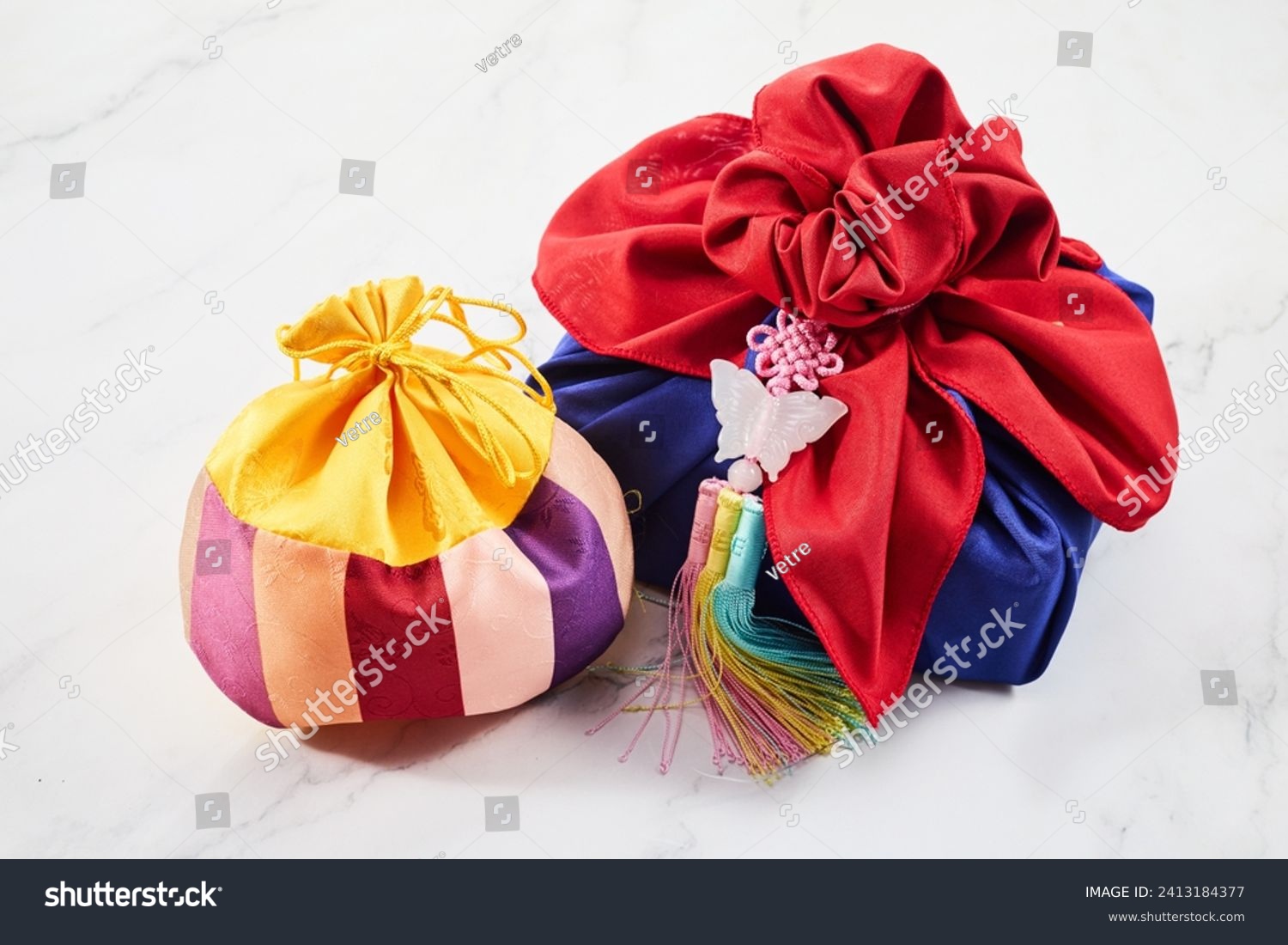 Happy Seollal  Korean New Year. Korean traditional wrapping decorated with silk and pendant