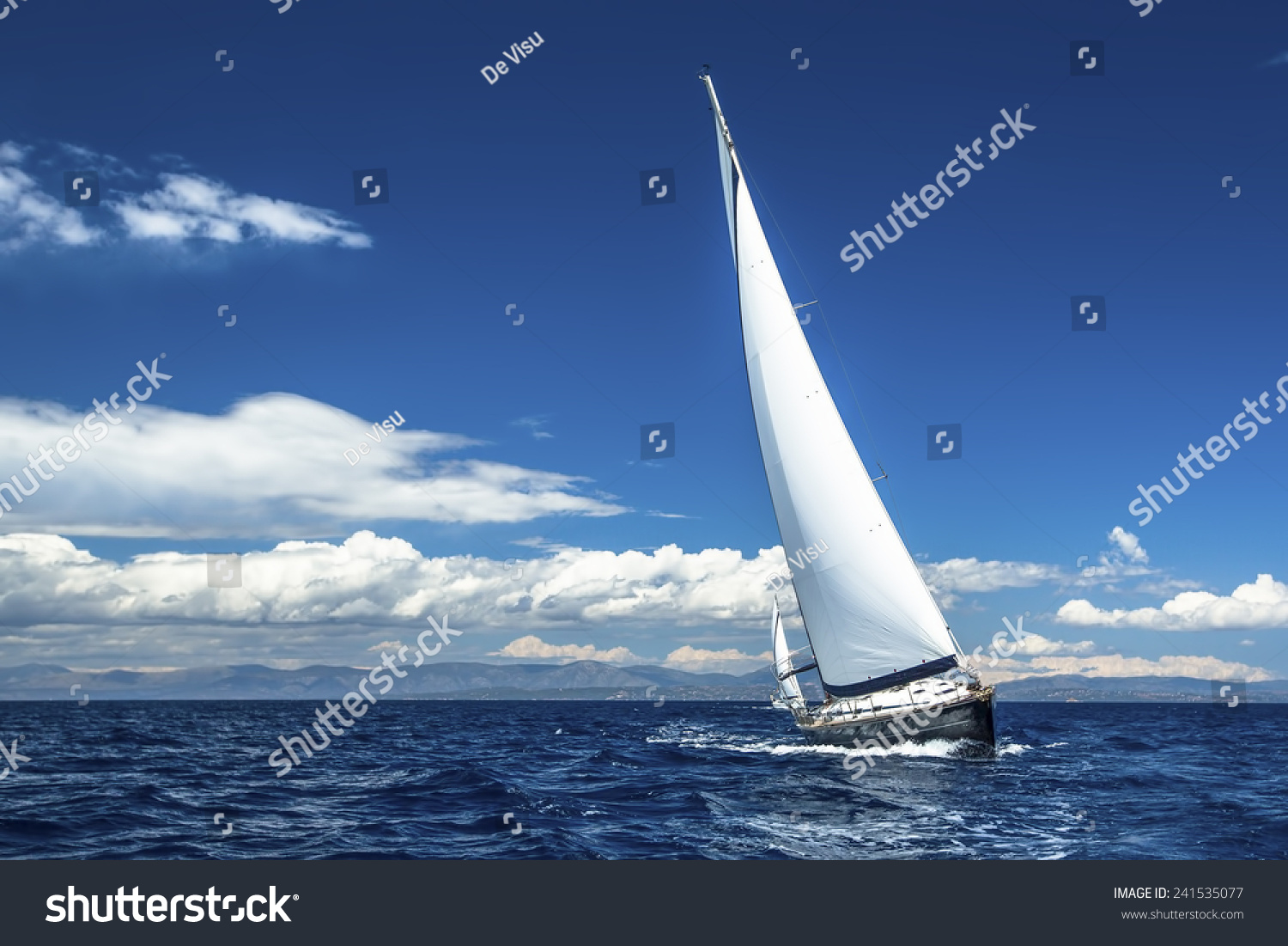 Sailing. Ship yachts with white sails in the open Sea. Luxury boats.