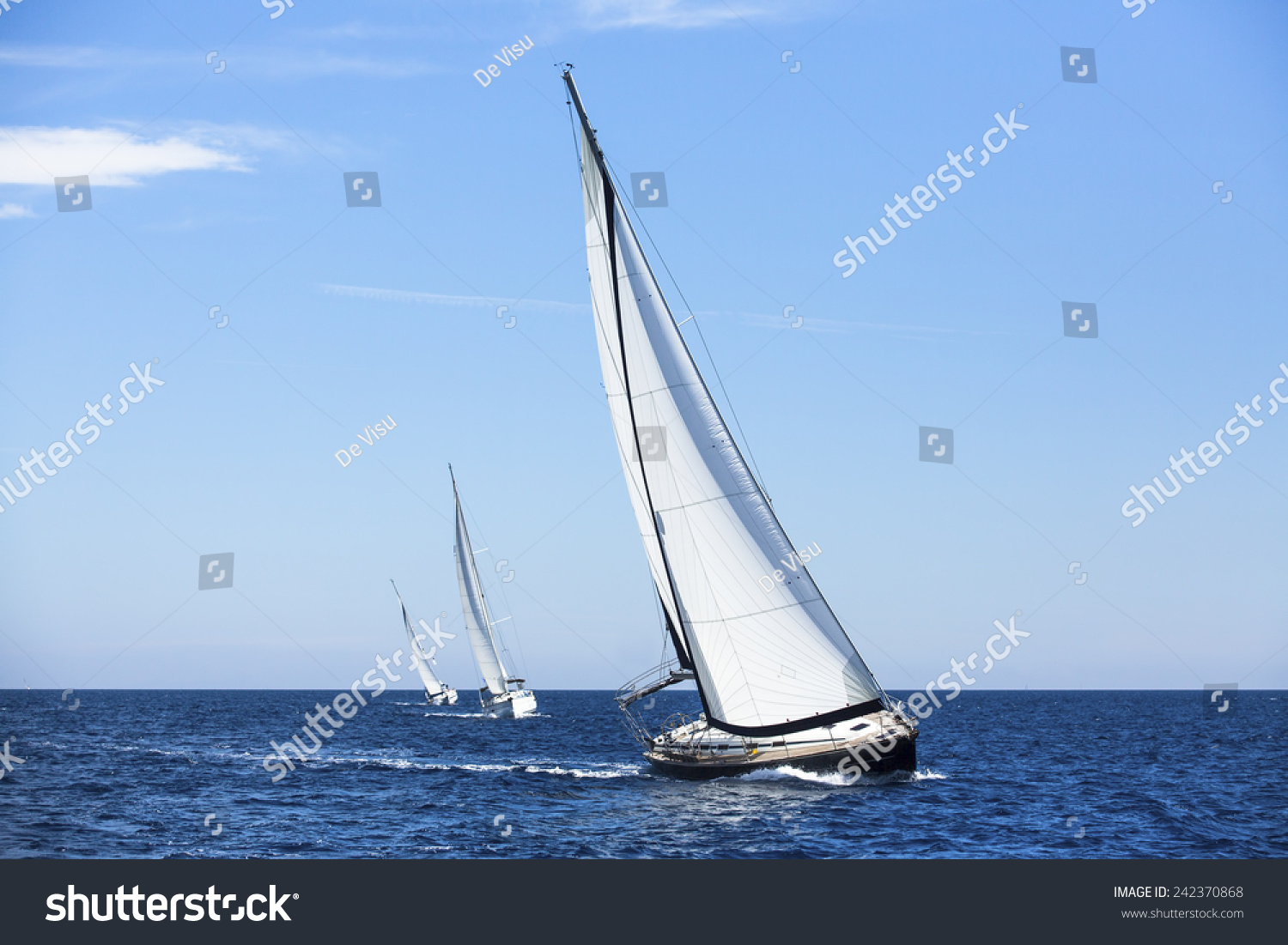 Sailing ship yachts with white sails. Luxury yachts. 