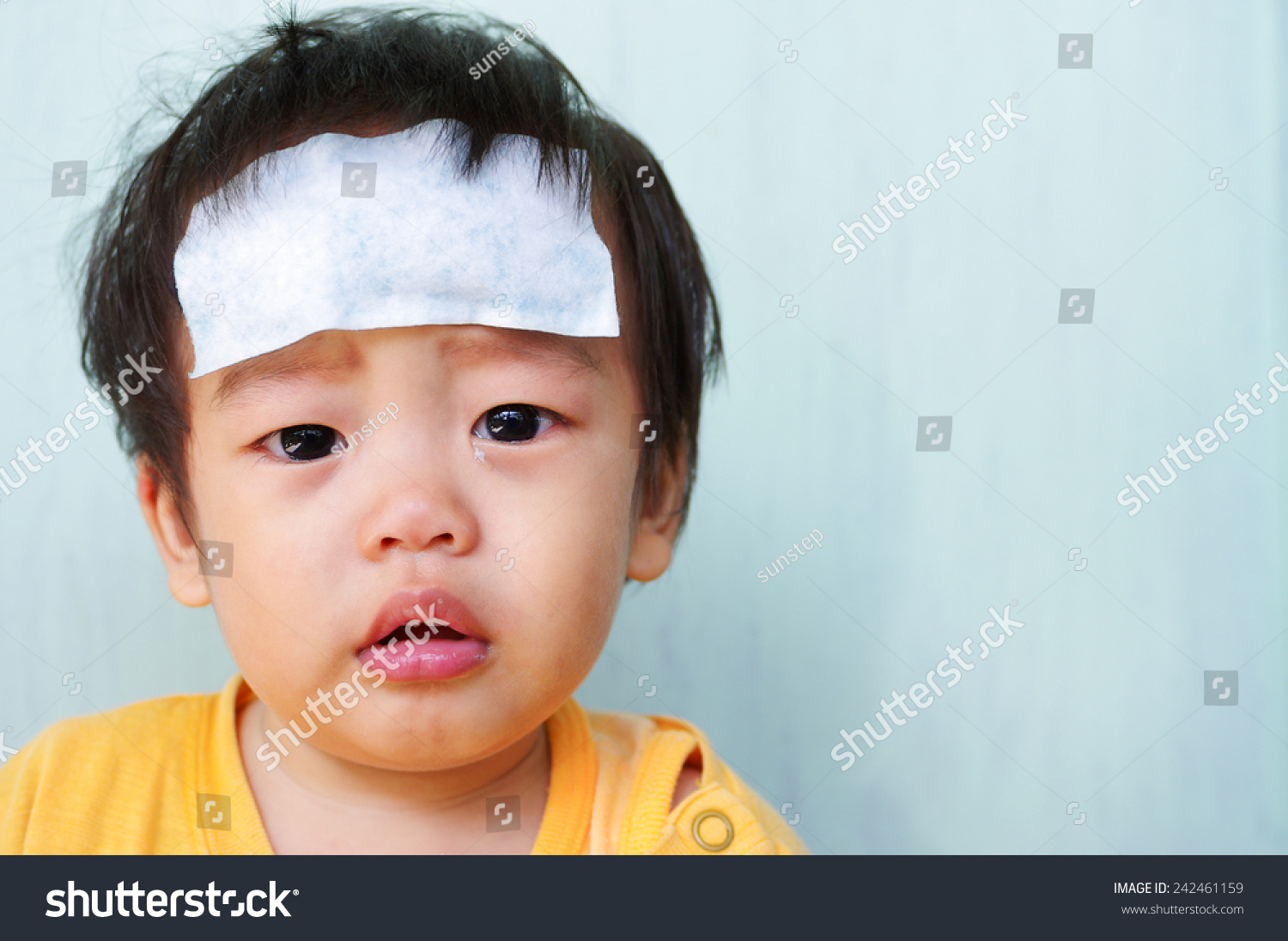 Baby illness medicine flu fever and cooling forehead.
