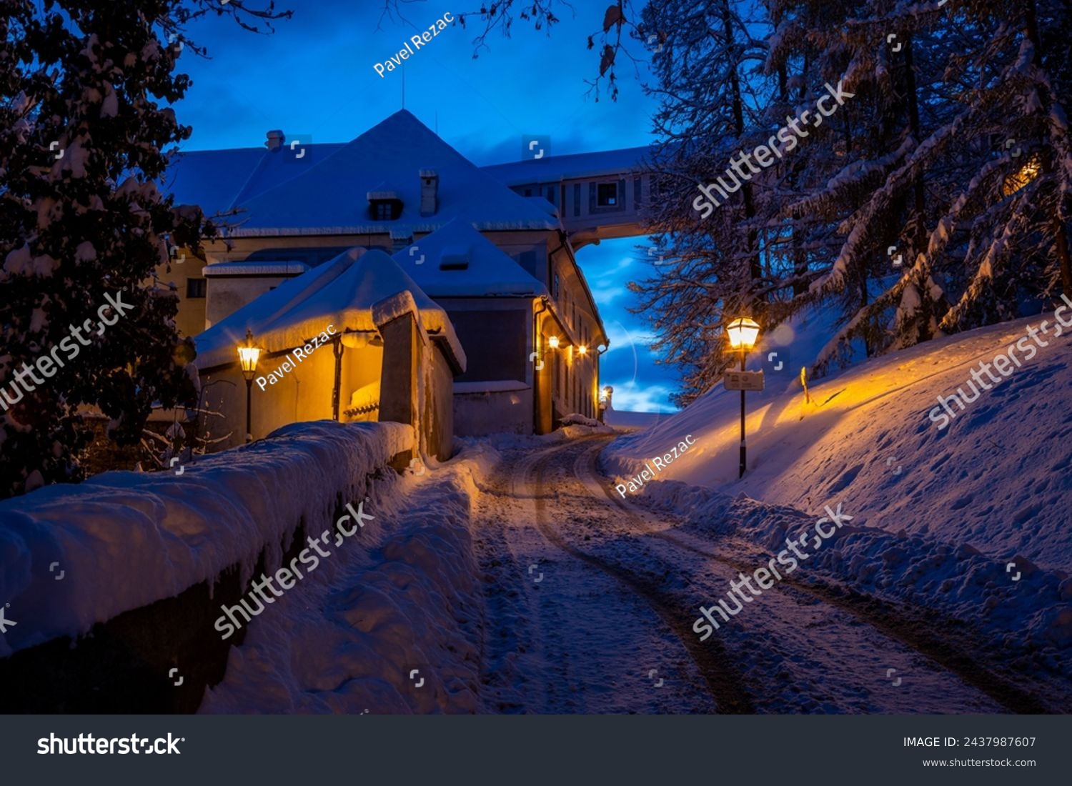 Winter view of Cesky Krumlov  picturesque houses under the castle with snow-covered roofs. Narrow streets and the Vltava river. Travel and Holiday in Europe. Christmas time. UNESCO. Czech Republic