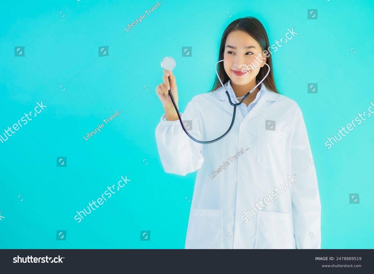 Portrait beautiful young asian doctor woman with stethoscope for use in clinic or hospital on blue isolated background