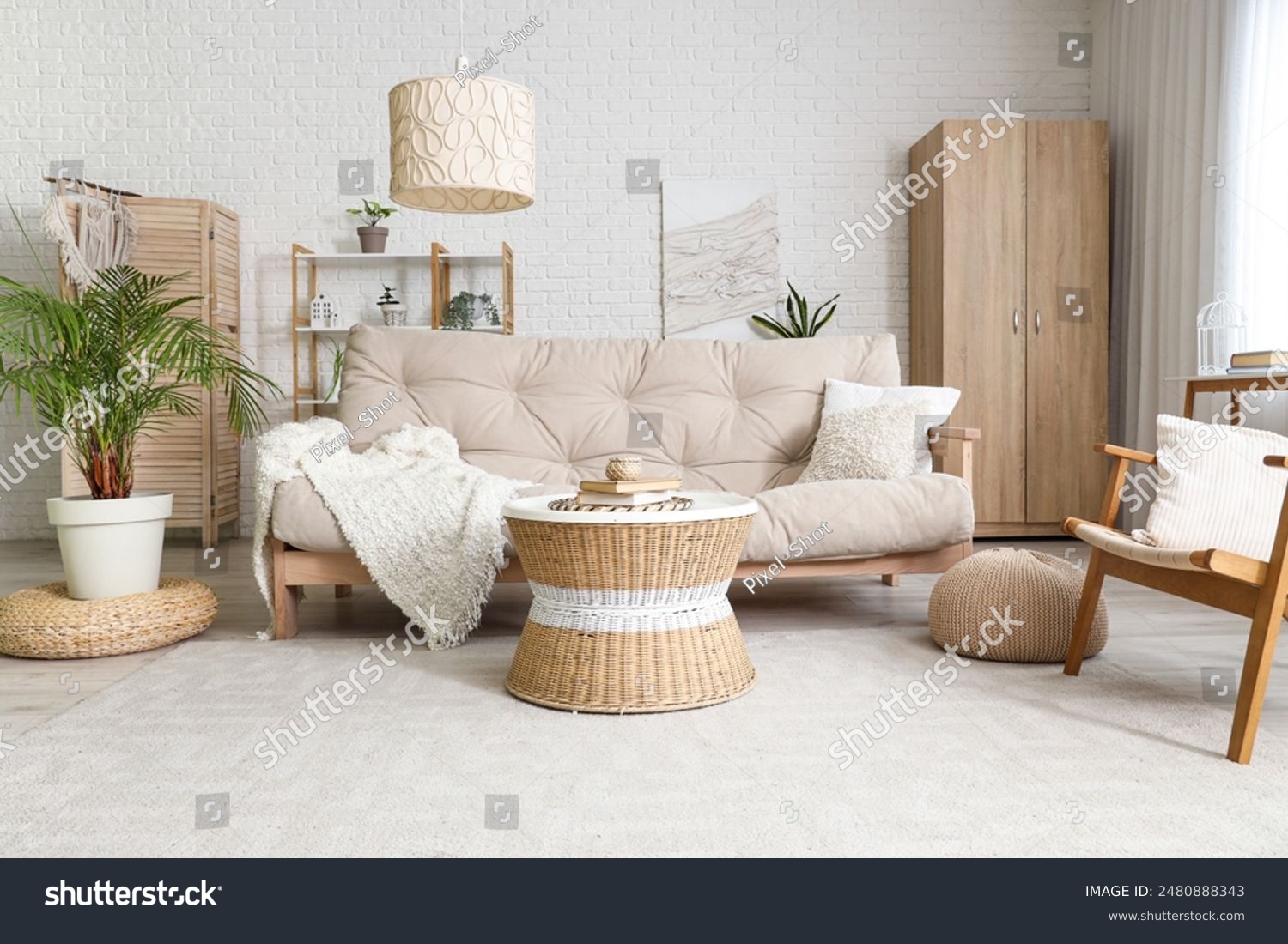 Interior of stylish living room with cozy sofa armchair houseplant and ...