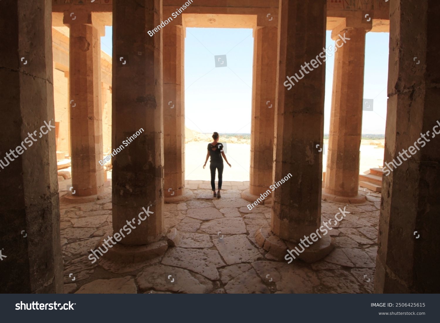 Woman Standing Amongst Columns in Egypt