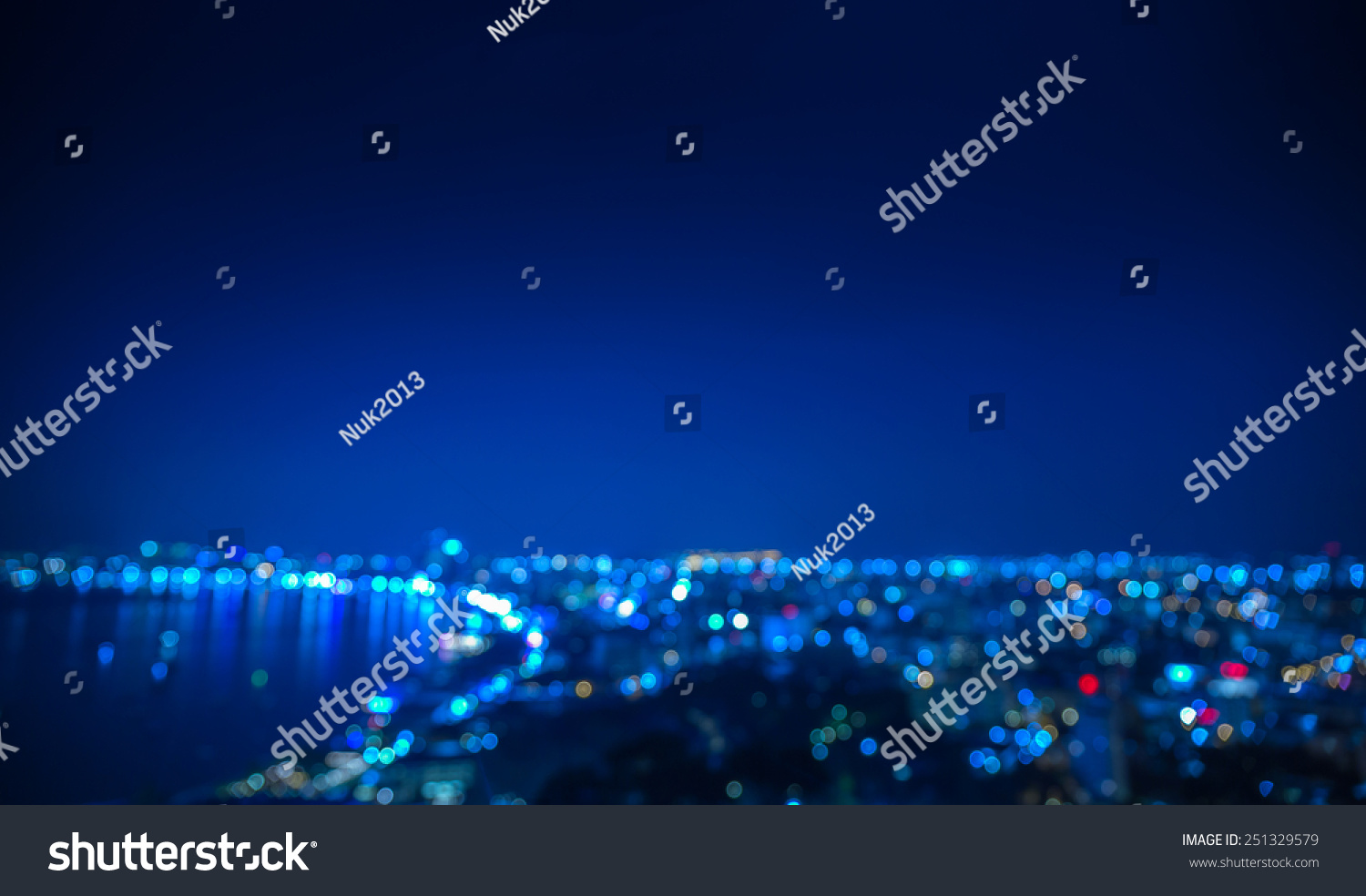 Out of focus coastal city in night time