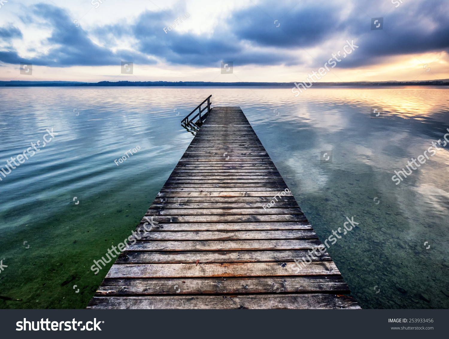 old wooden jetty at the chiemsee lake in bavaria