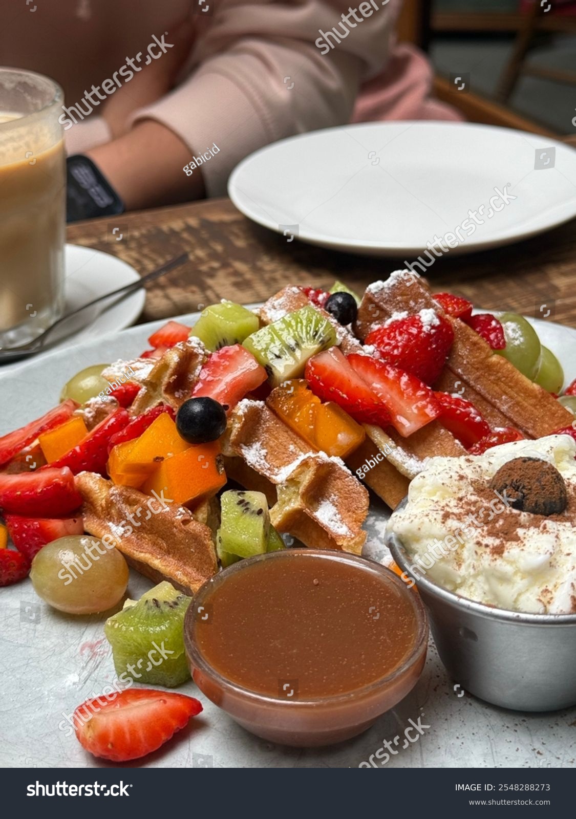 delicious food waffle with fruits like kiwi strawberries and