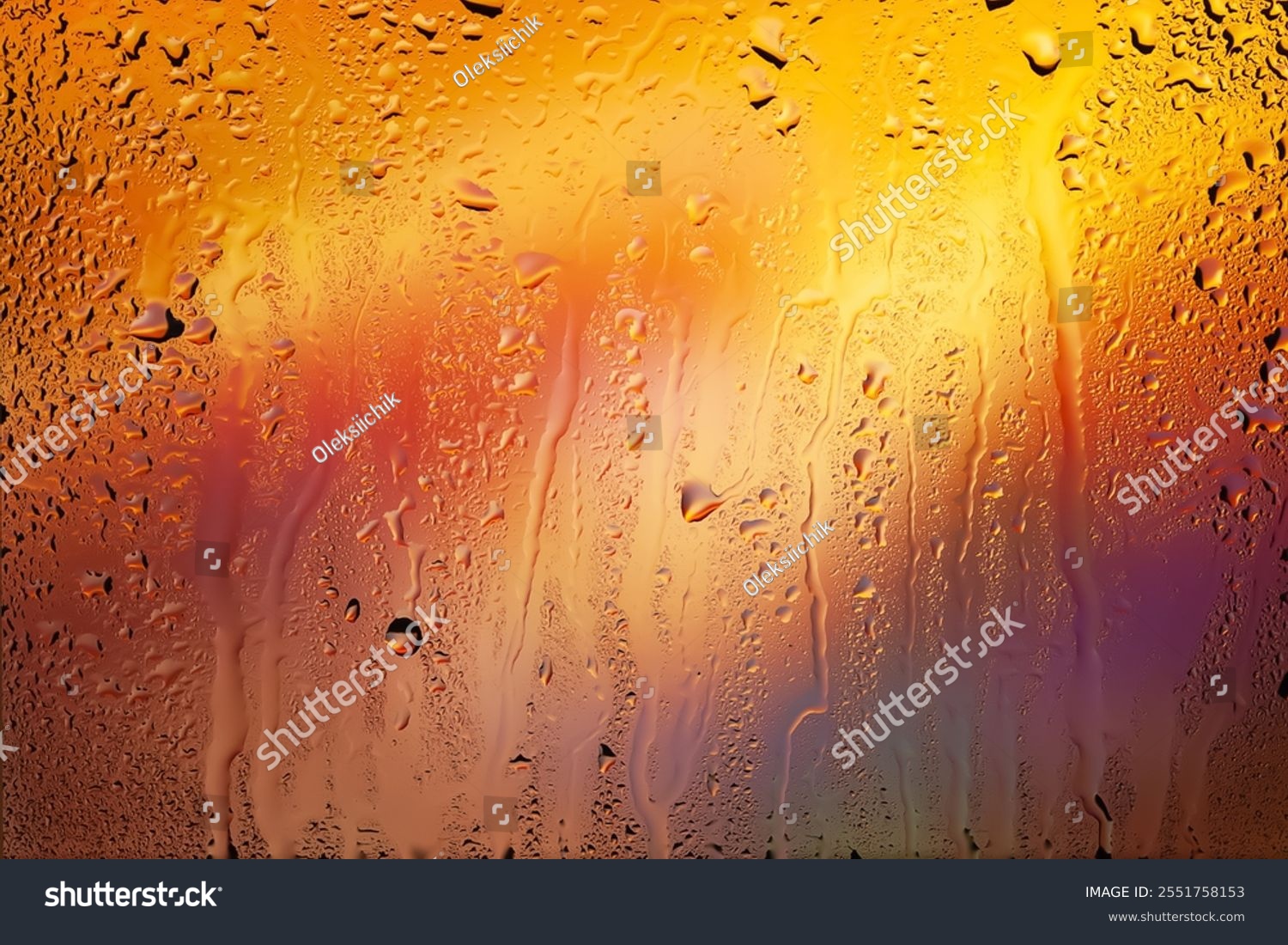 Drops of rain on the window. Water drops on glass. Abstract background. Multi-colored spots. Drops texture. Soft focus