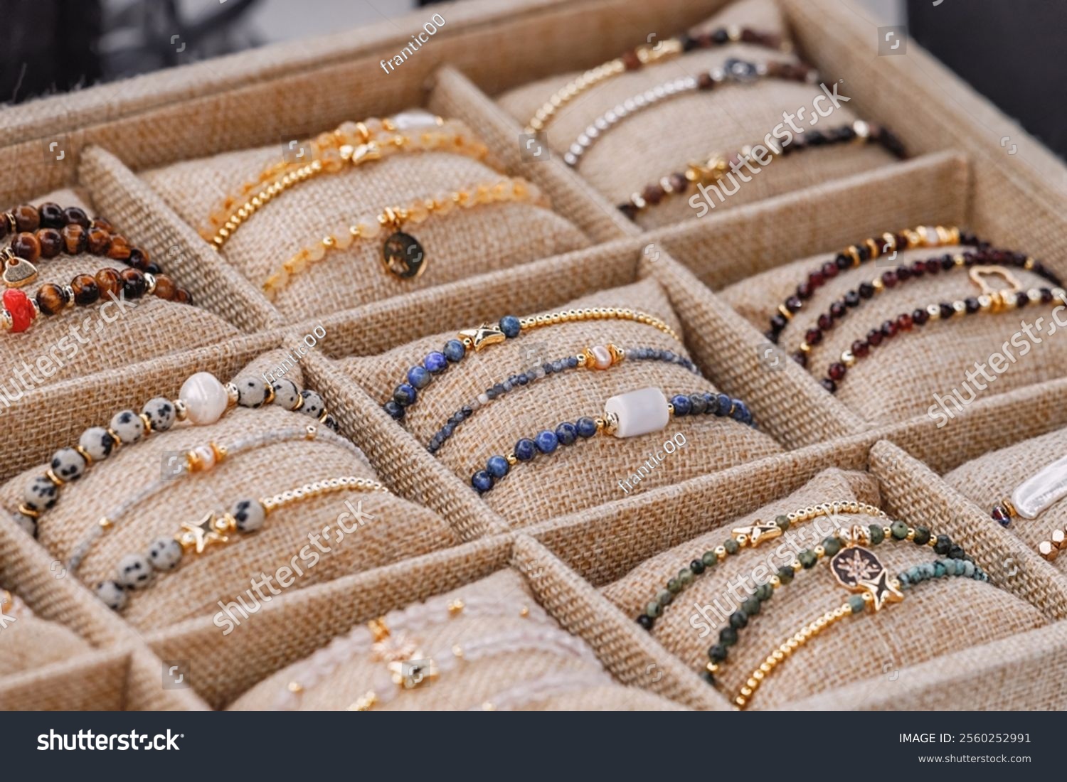 A rich assortment of crafted jewelry  bracelets  exuding sophistication and elegance  perfect for a lady collection.