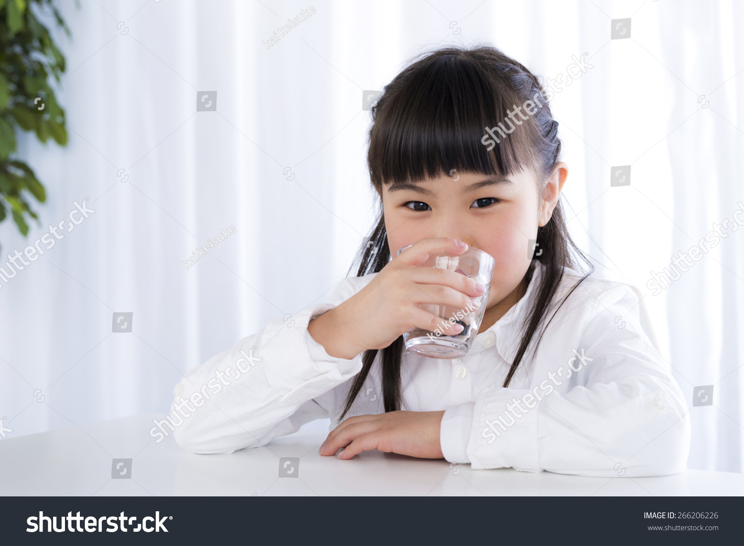 little girl have a drink of water