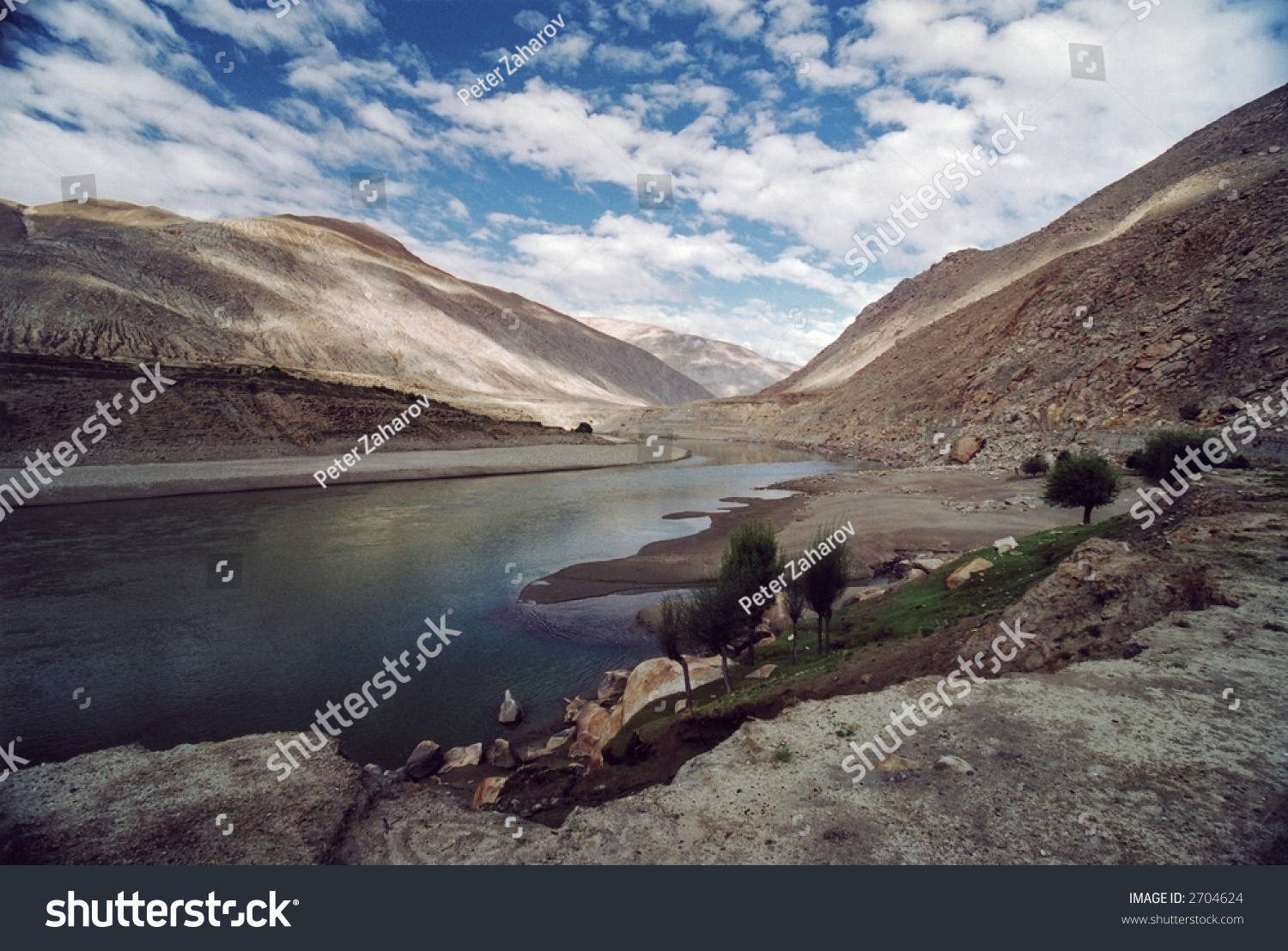 Tibetian landscape with clouds and river Brahmaputra.