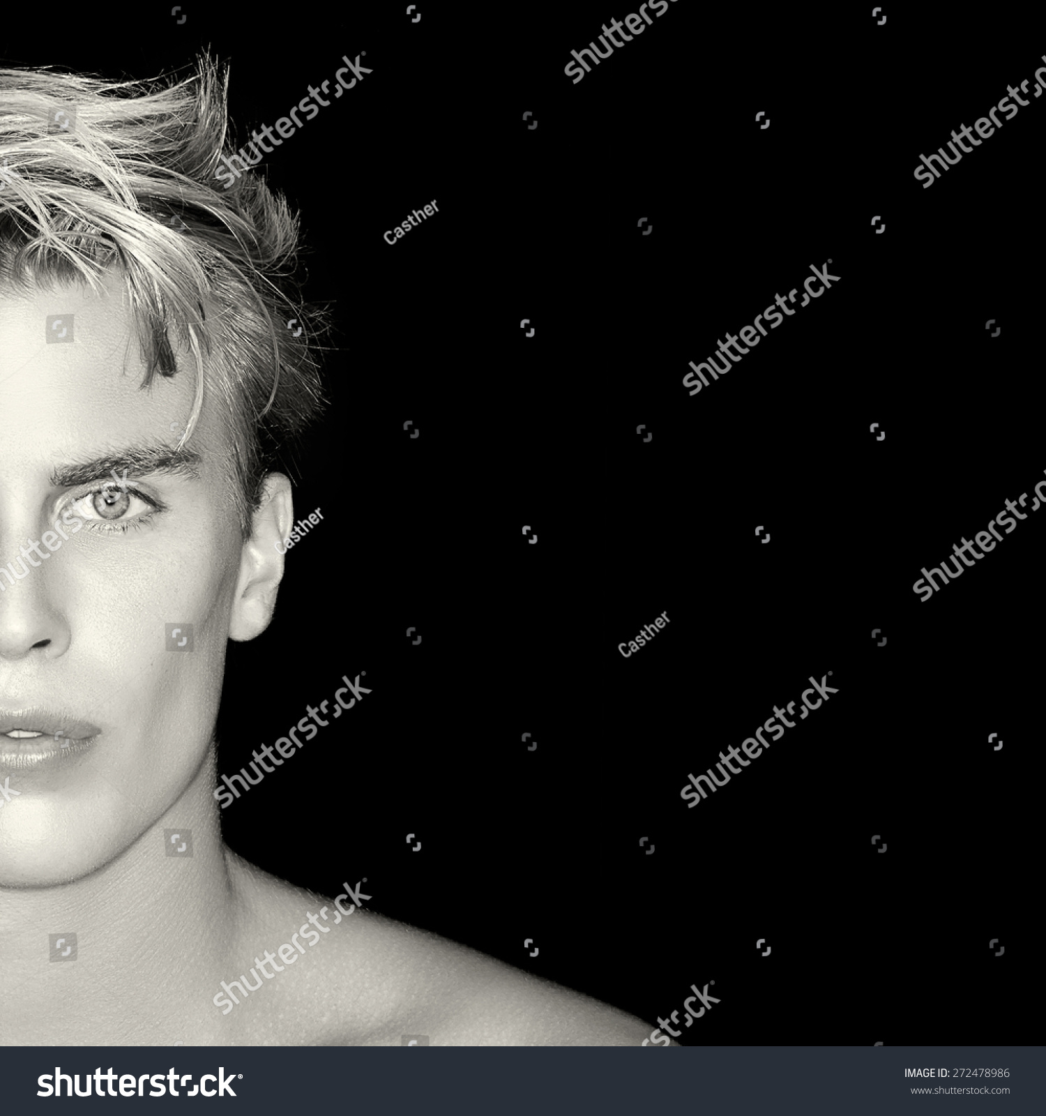 Beauty Skincare and Haircare concept. Handsome young man on black background. Perfect skin. Man half face portrait