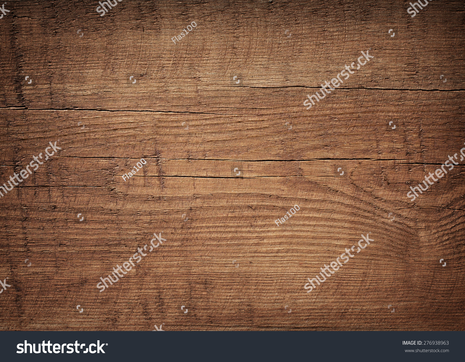 Dark brown scratched wooden cutting board. Wood texture