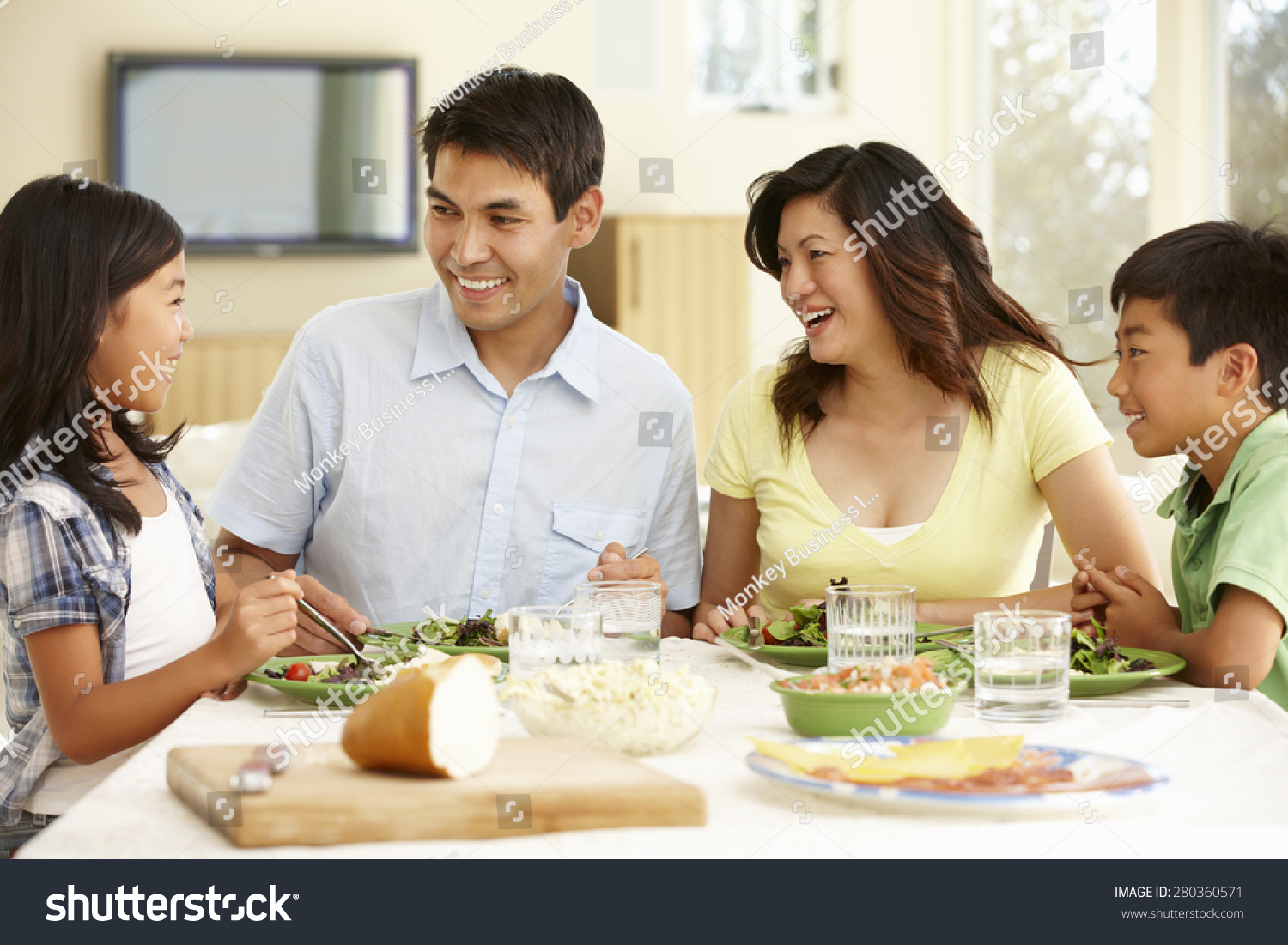 Asian family sharing meal at home