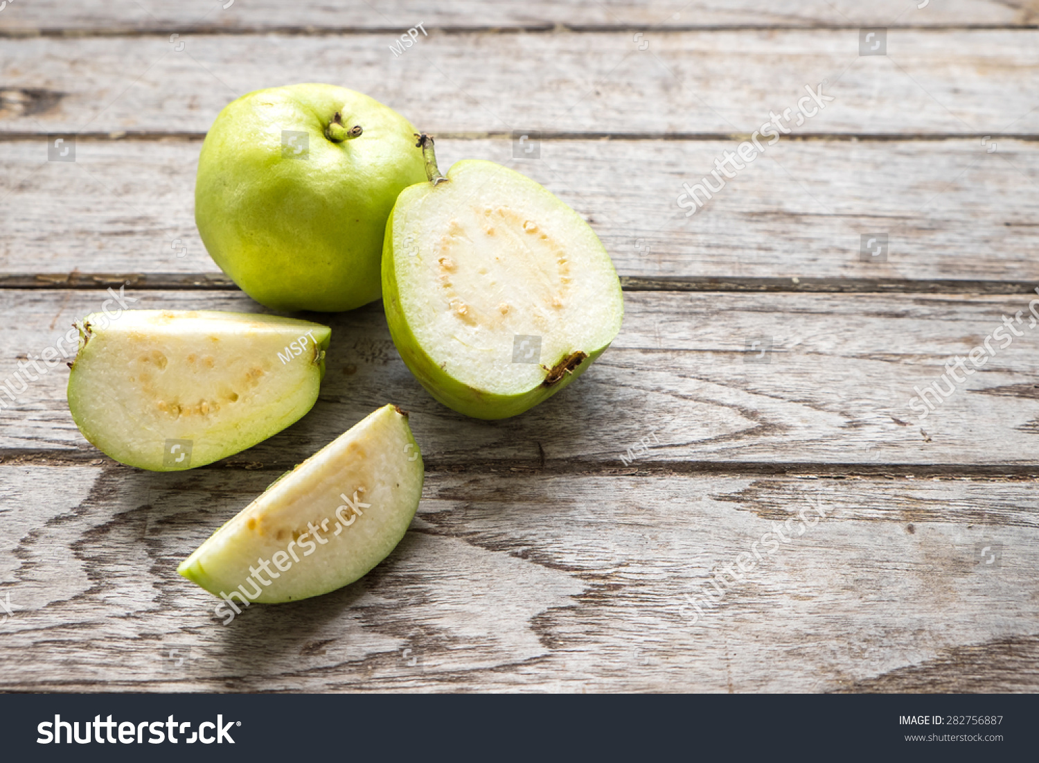 Guava fruit cut on wooden