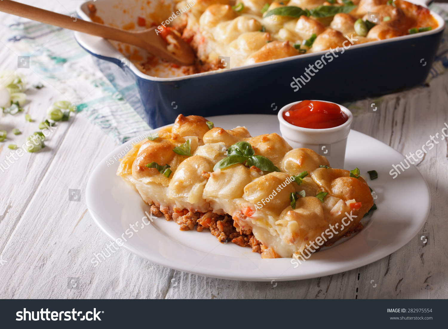 shepherds pie slice closeup on a white plate. horizontal