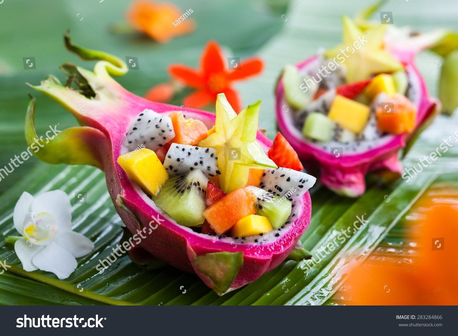 Exotic fruit salad served in half a dragon fruit