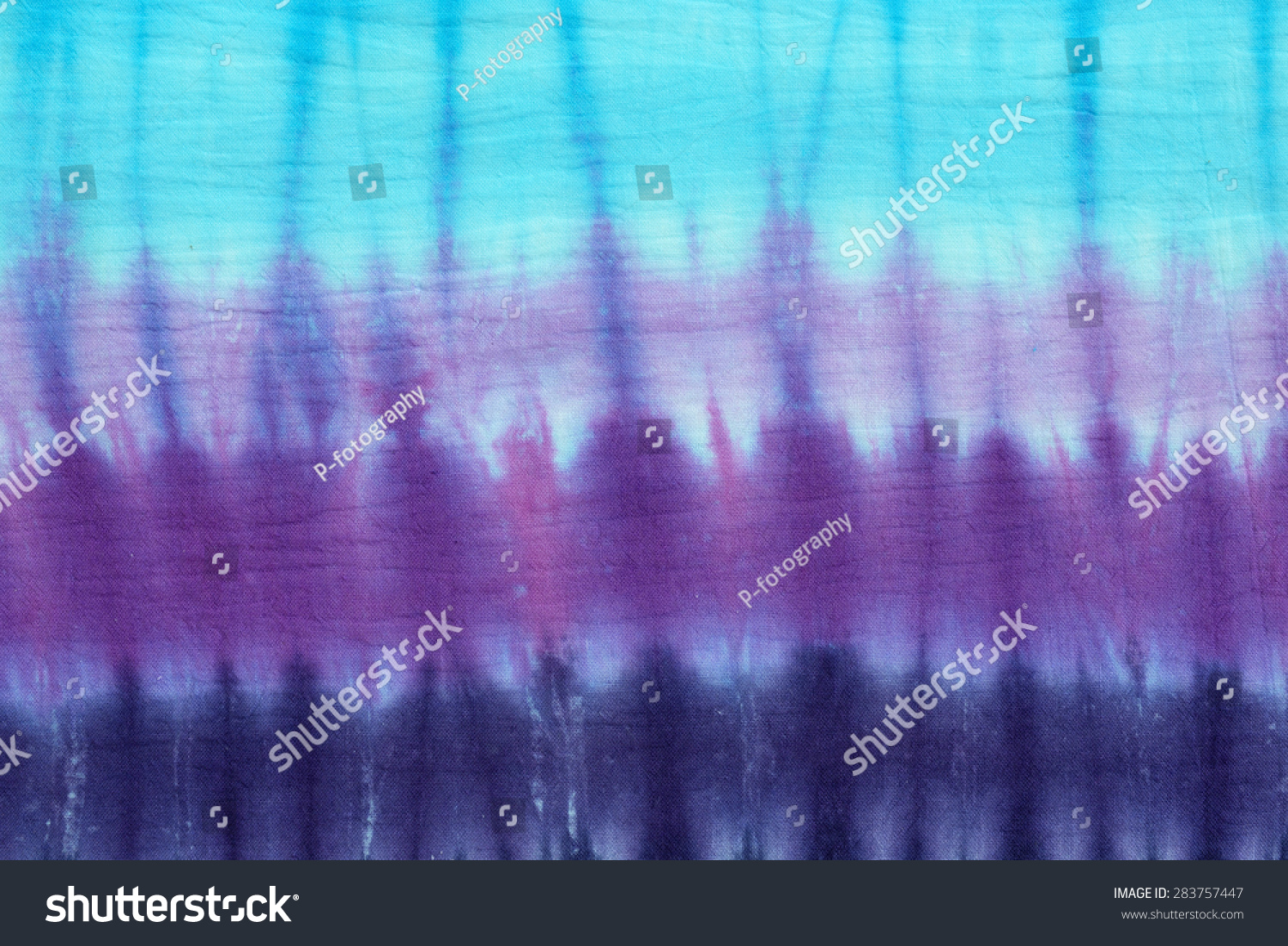 tie dyed pattern on cotton fabric for background.

