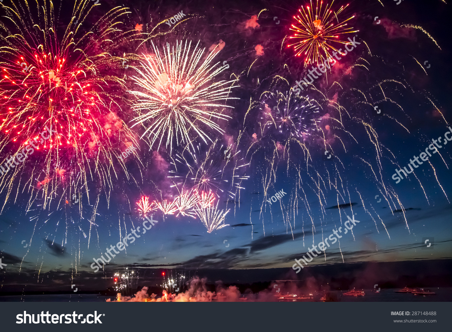 colorful fireworks on the black sky background over-water