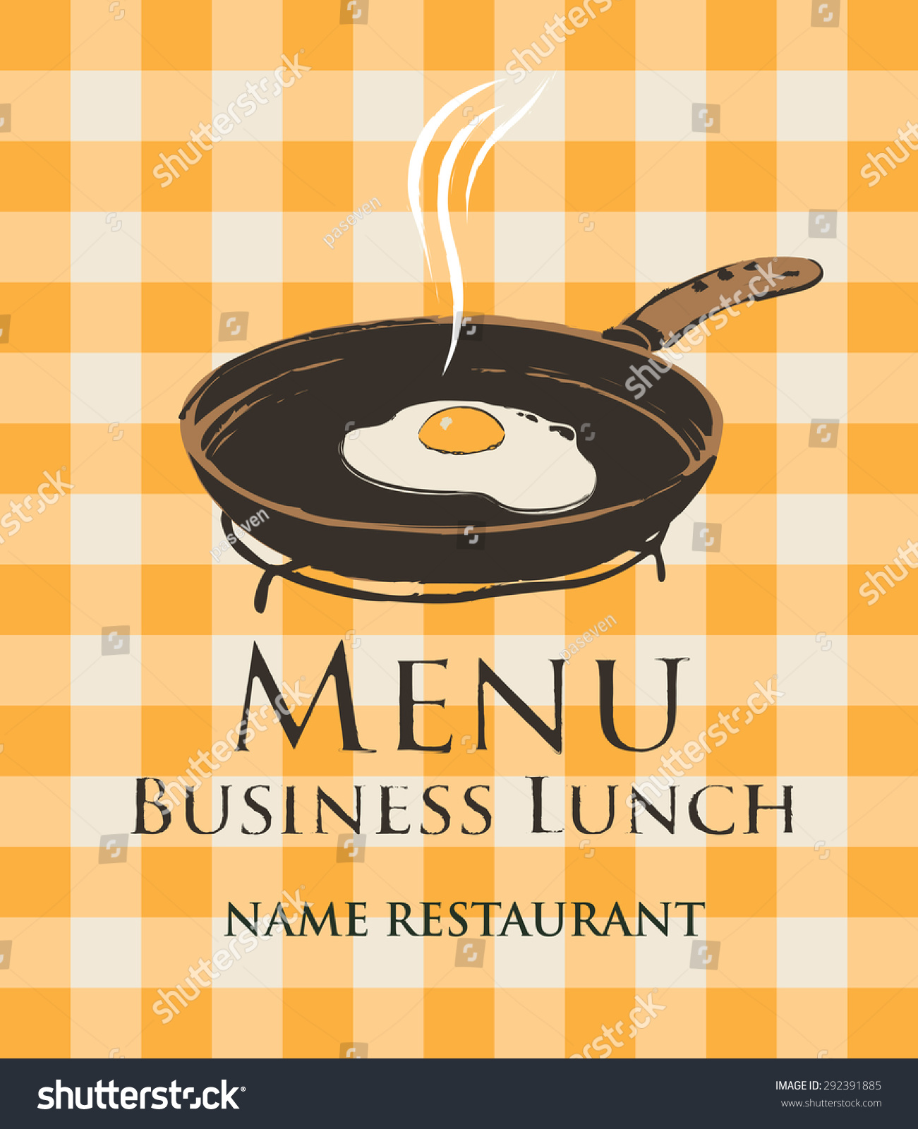 business lunch with a frying pan and fried eggs on the background of a checkered tablecloth