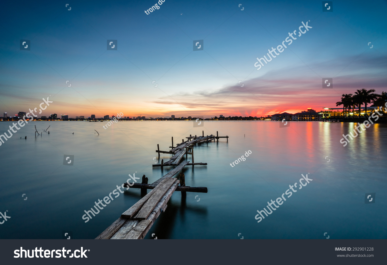 The wooden bridges on the lake in the sunset