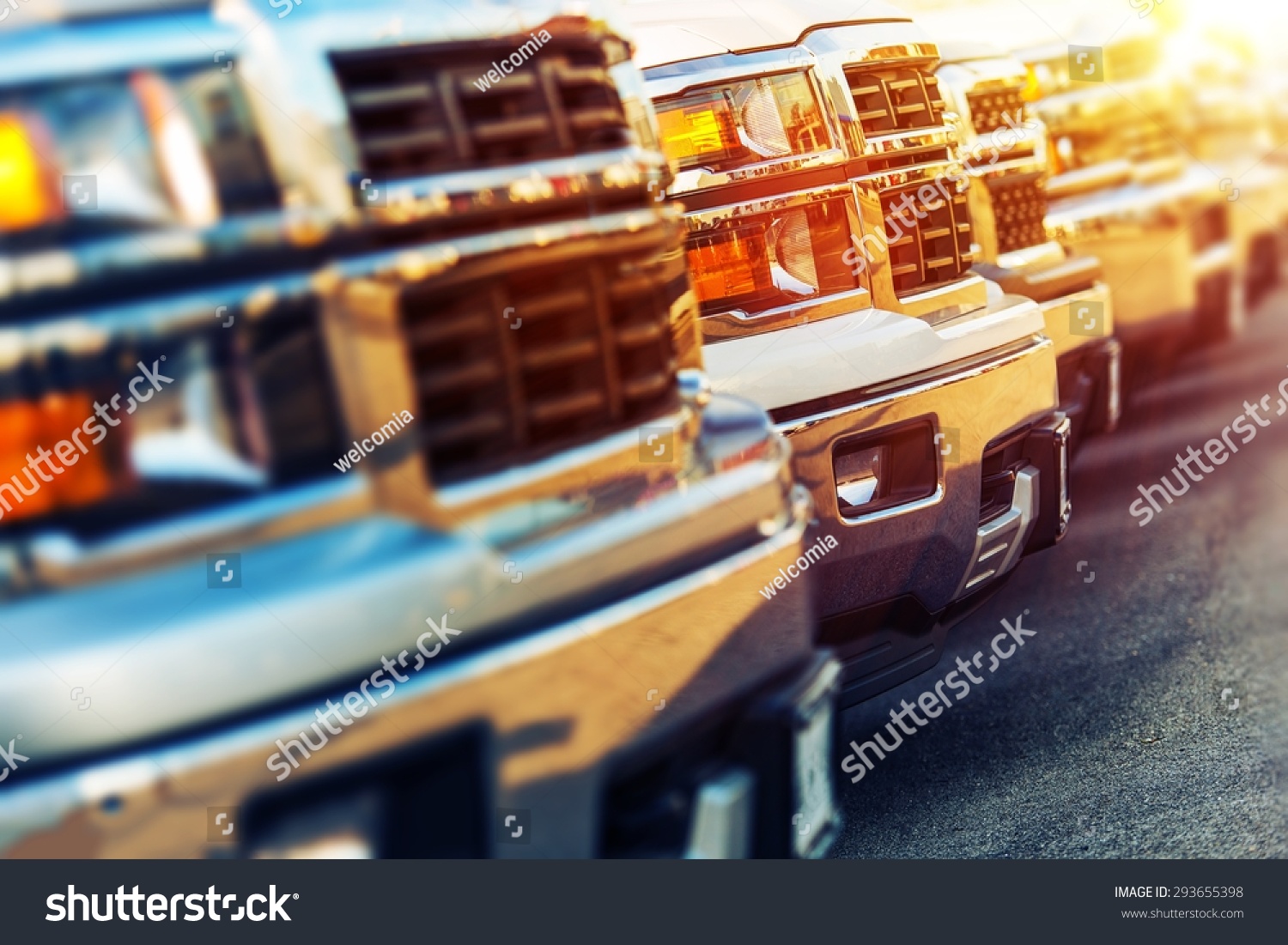 Car Sales Business Photo Concept. Row of Brand New Vehicles For Sale at Dealer Parking Lot. American Car Sale Business.