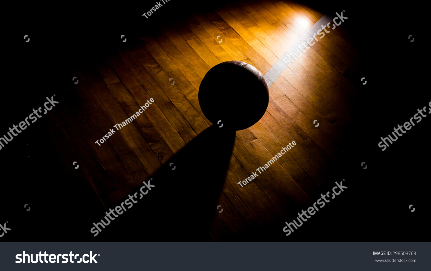 Basketball on court with light effect 