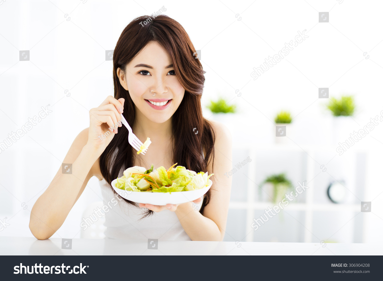 beautiful asian young woman eating healthy food