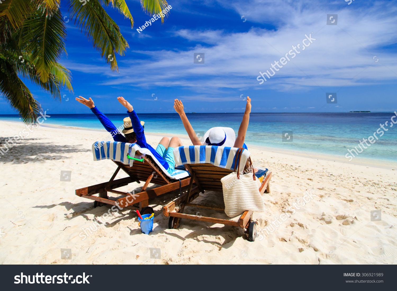 happy couple relax on a tropical sand beach