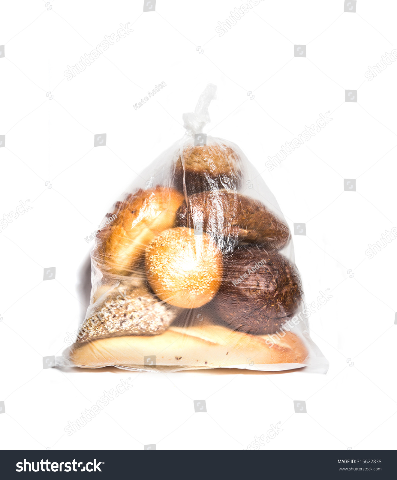 different kinds of bread in transparent bag isolated on white