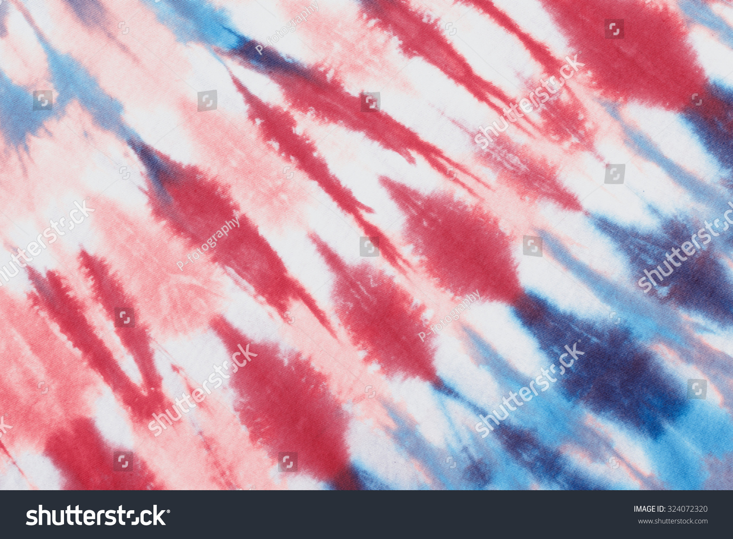 tie dye pattern hand dyed on cotton fabric background.

