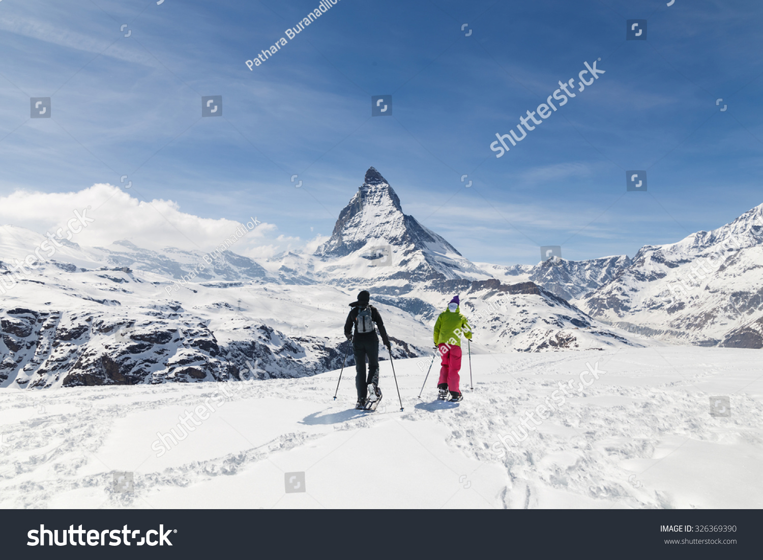 Men walking on ski in the background of Matterhorn  Zermatt  Switzerland.