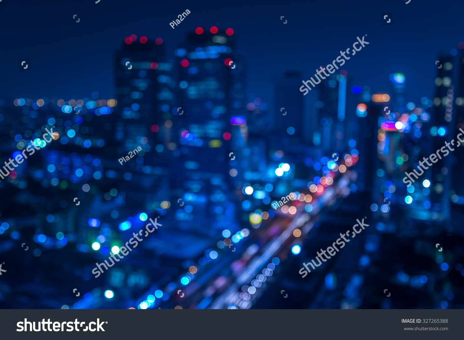 Defocused urban abstract texture -blurred background with bokeh of city lights from car on street at night