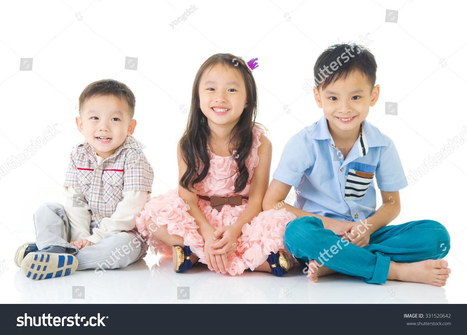 Asian kids sitting on the floor