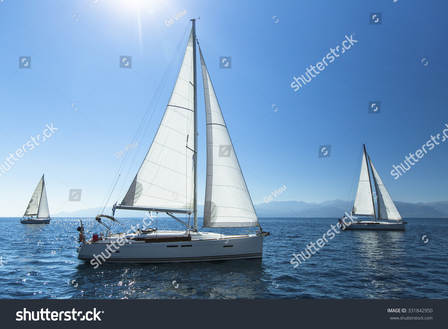 Sailing regatta. Sailing in the wind through the waves. Luxury yachts.
