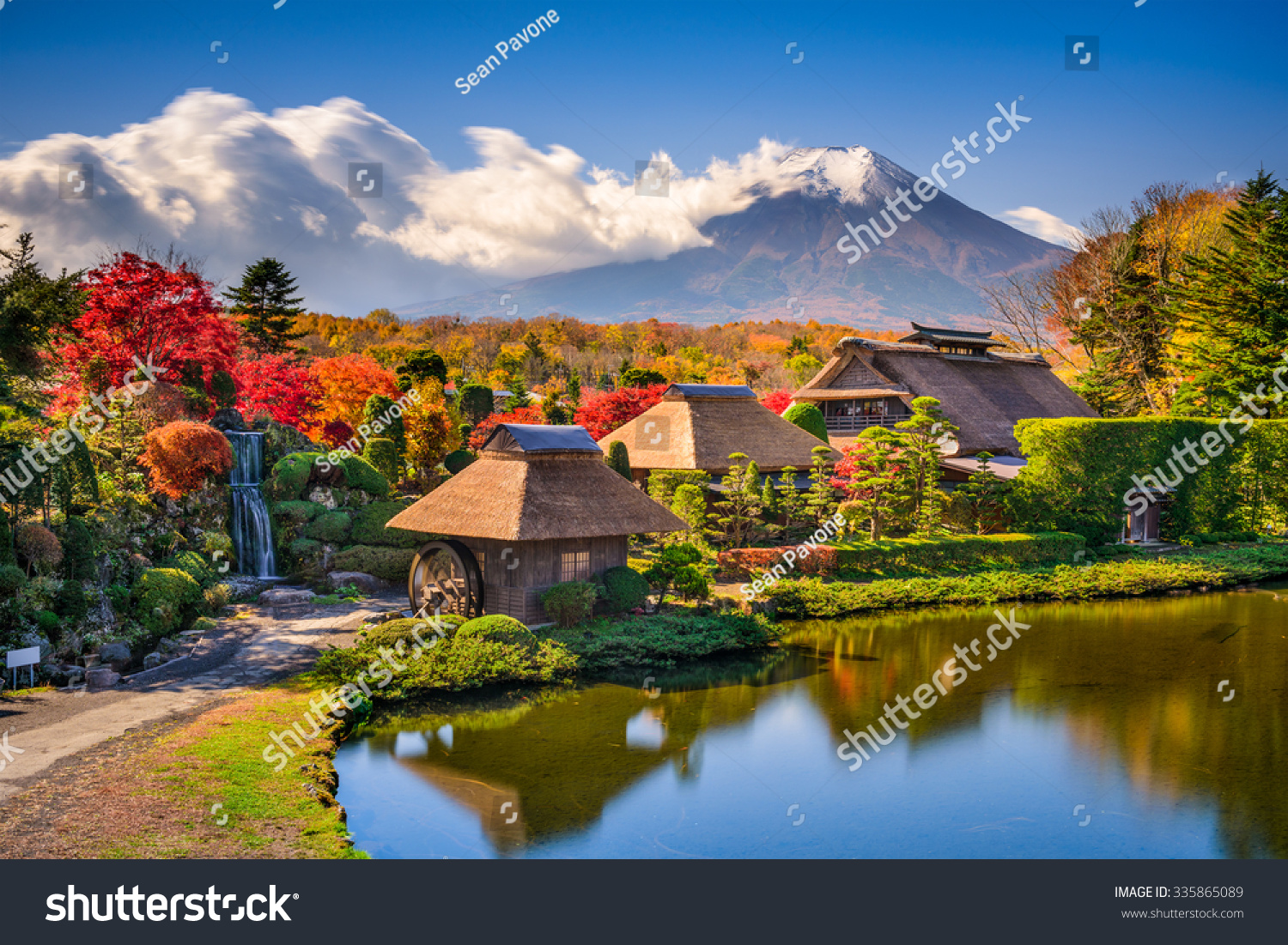 Oshino  Japan historic thatch roof farmhouses with Mt. Fuji.