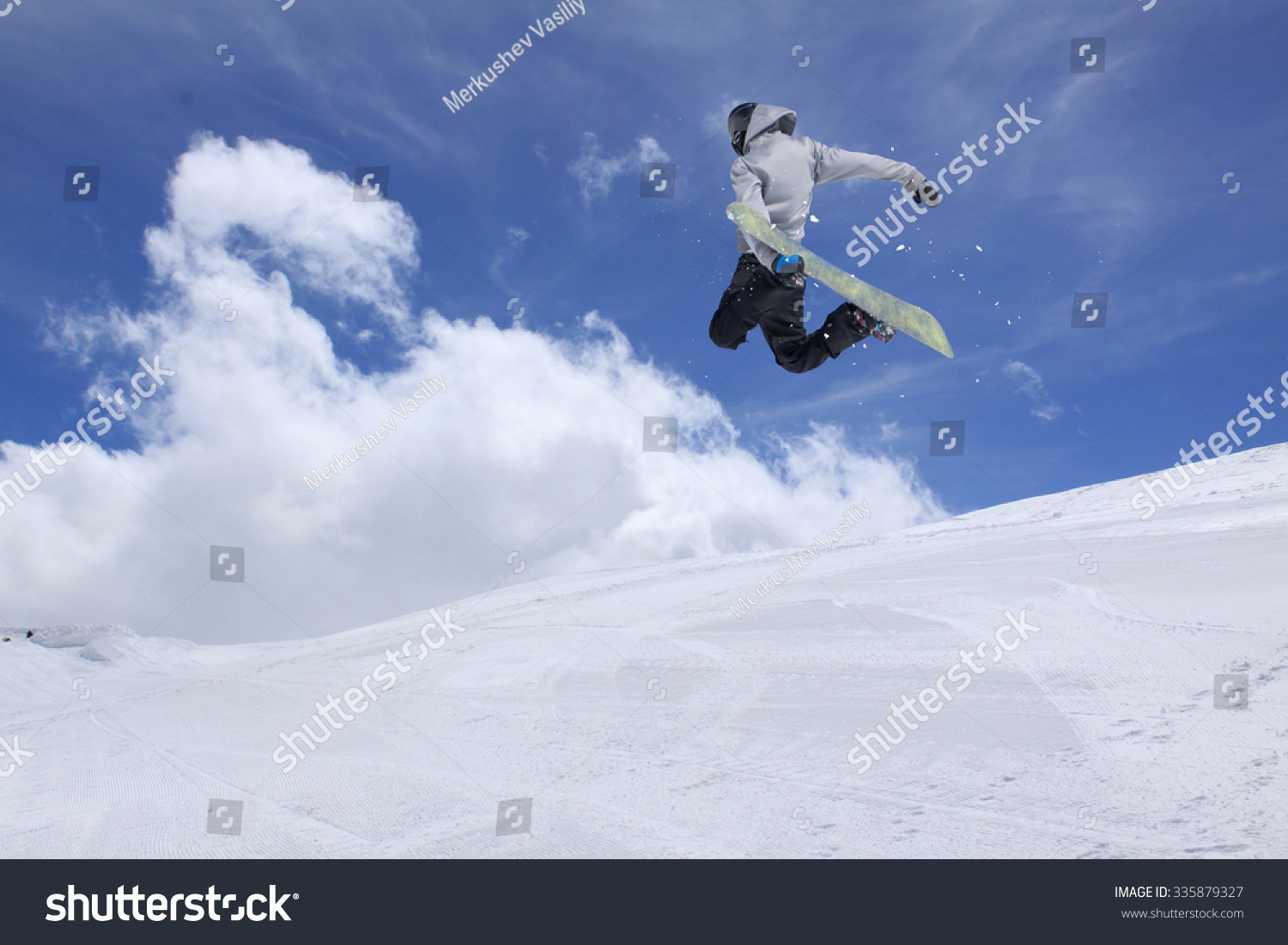 Flying snowboarder on mountains  extreme winter sport