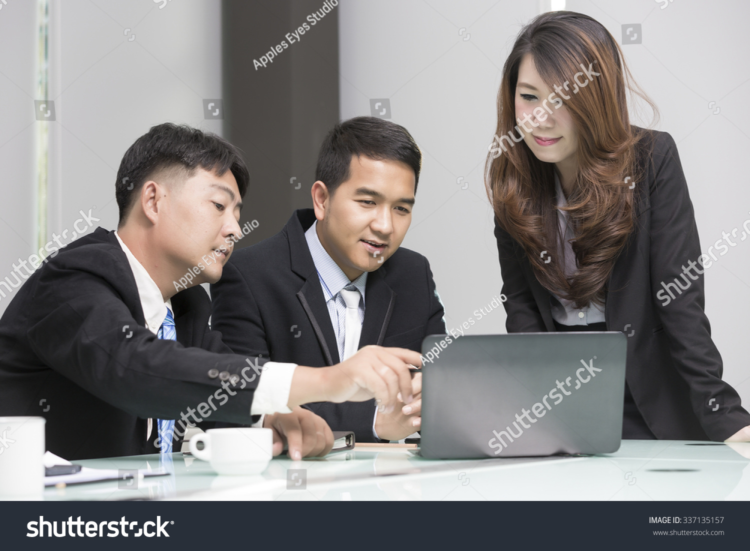 Asian business  technology and office concept - strict female boss talking to business team.