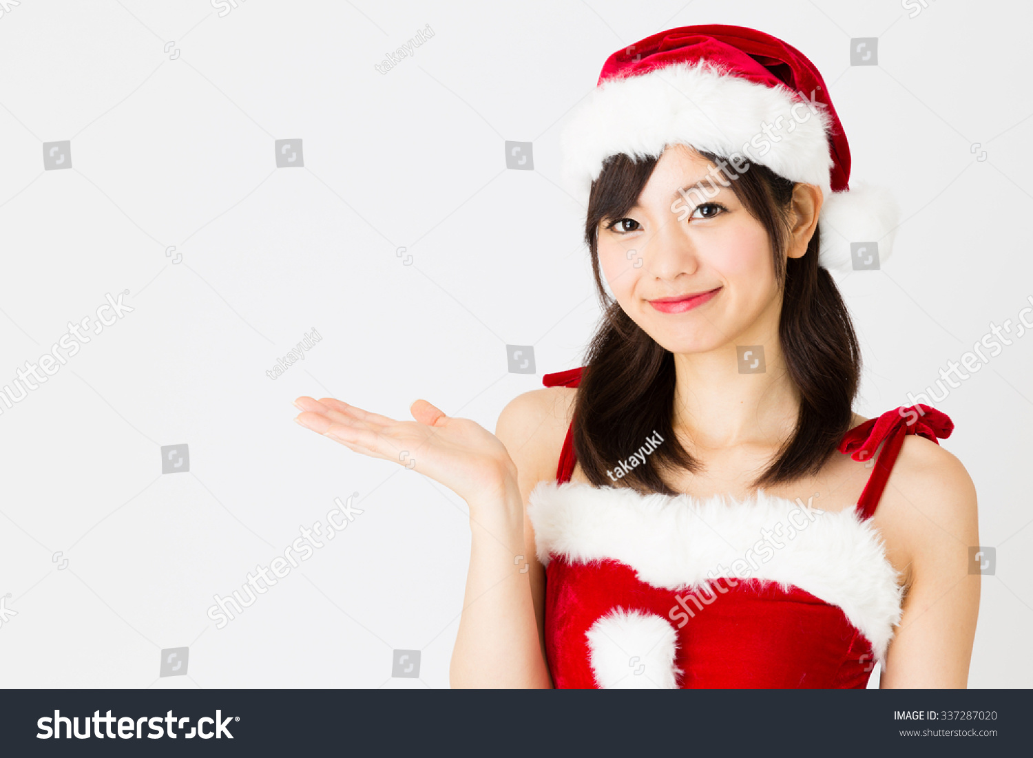 portrait of young asian woman wearing santa costume