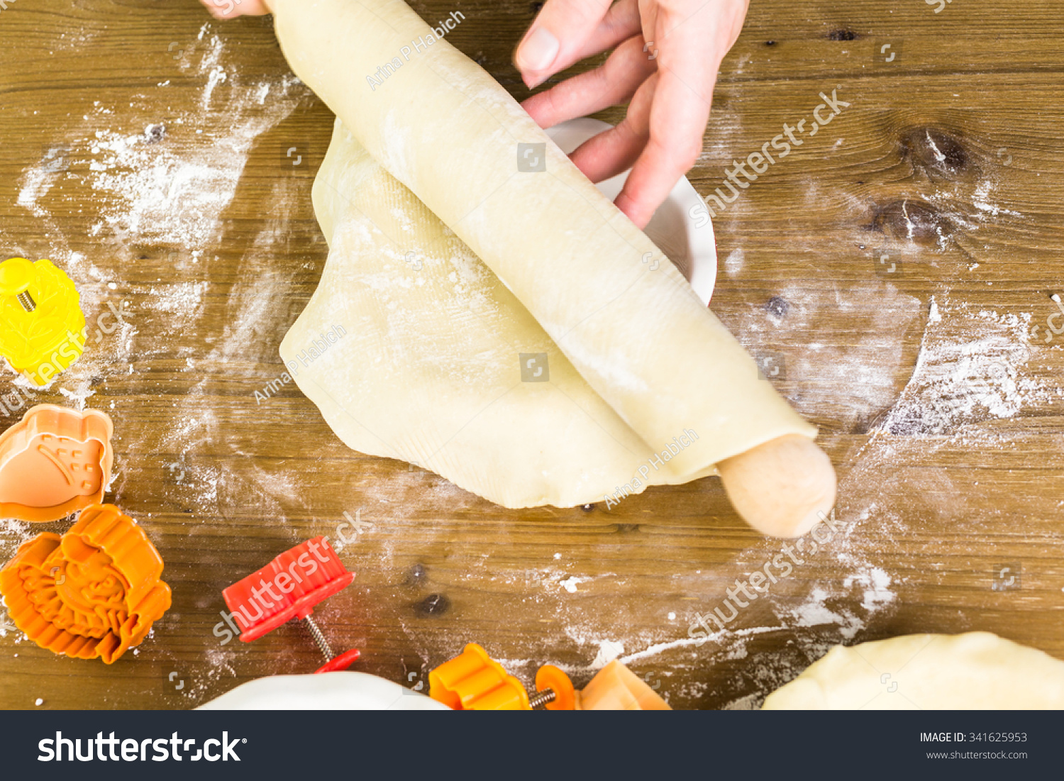 Rolling our the dough for pie crust for  pumpkin pie.