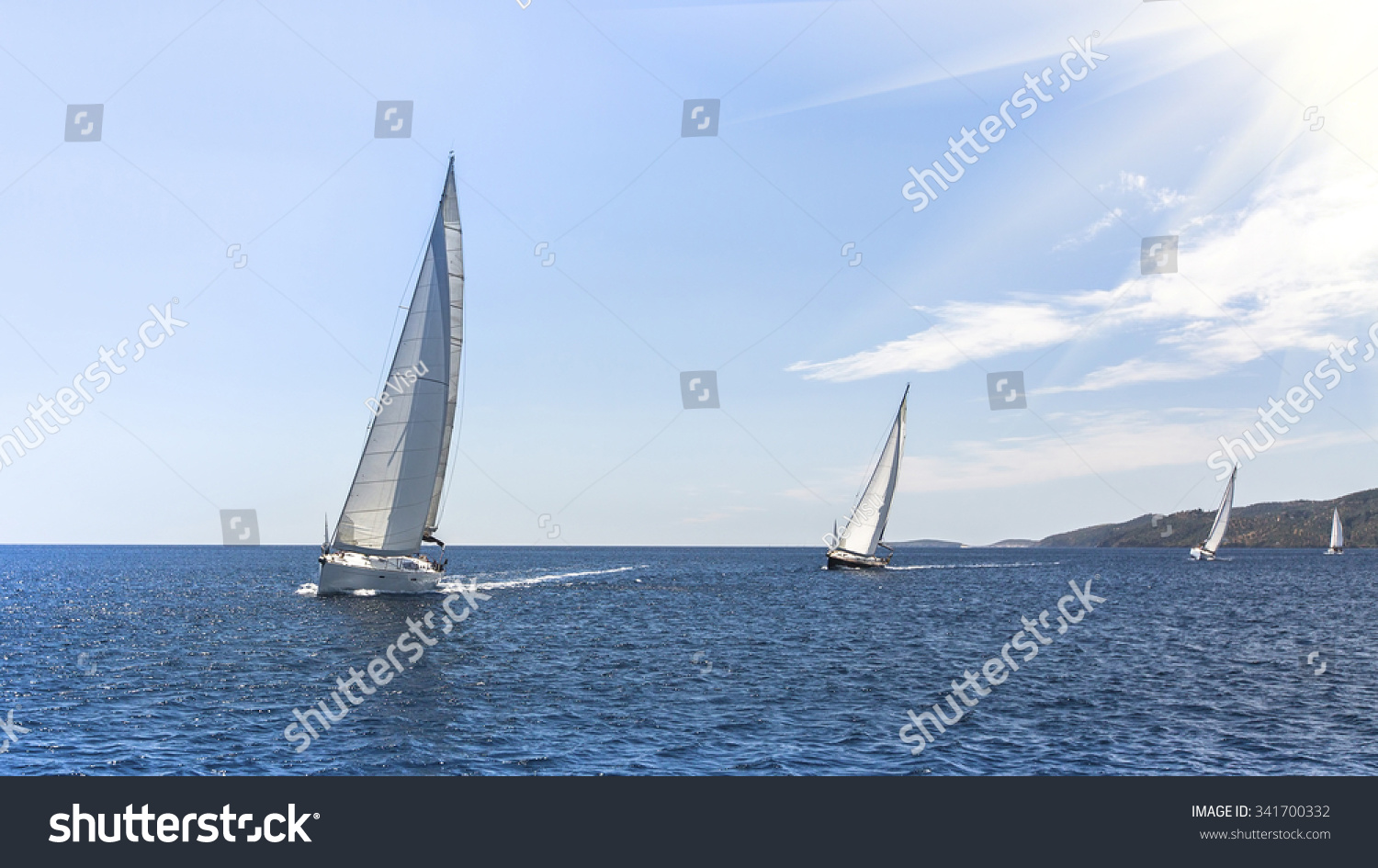 Sailing regatta. Sailing in the wind through the waves at the Aegean Sea in Greece. 