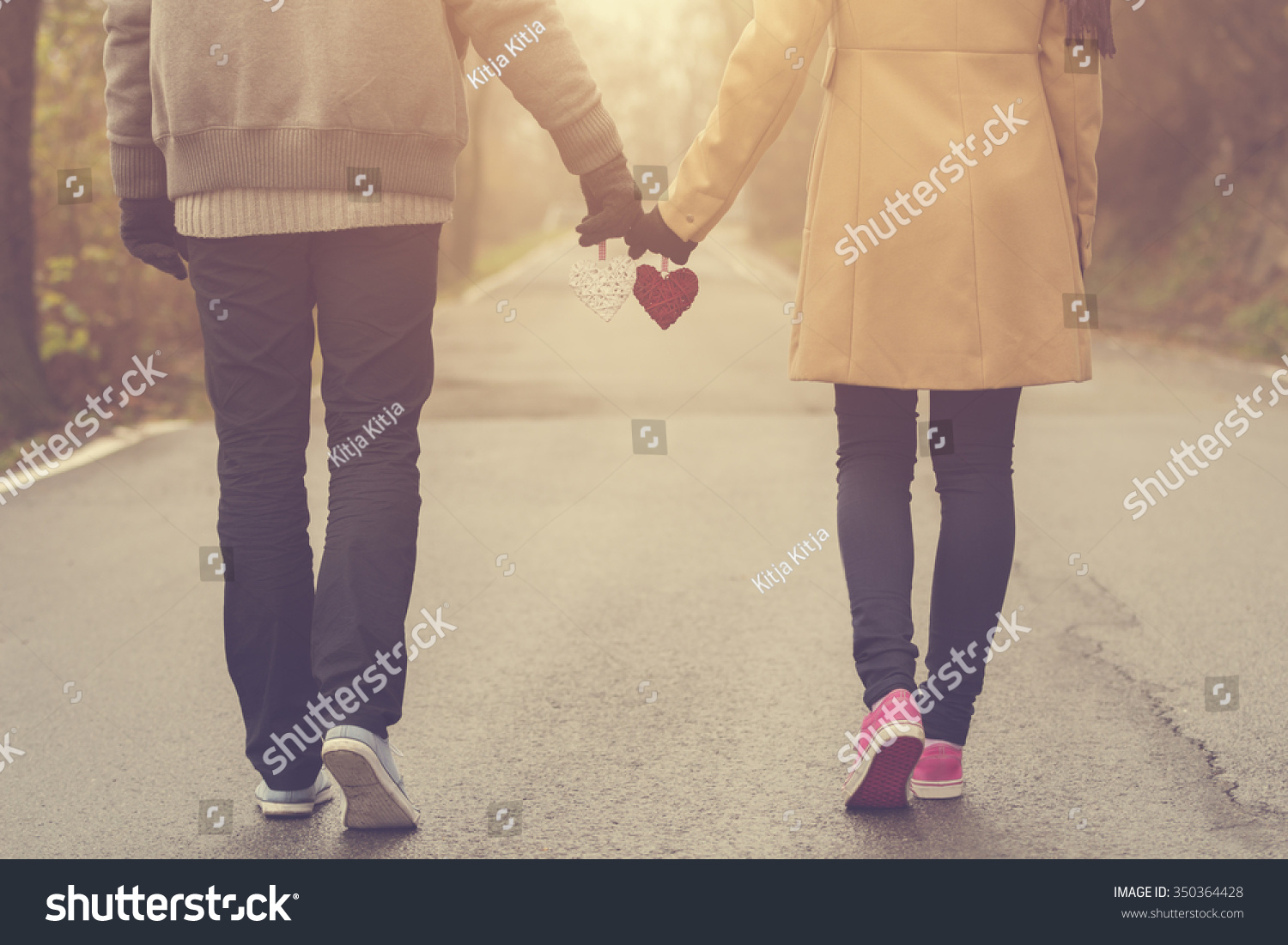 Couple in love holding hearts.