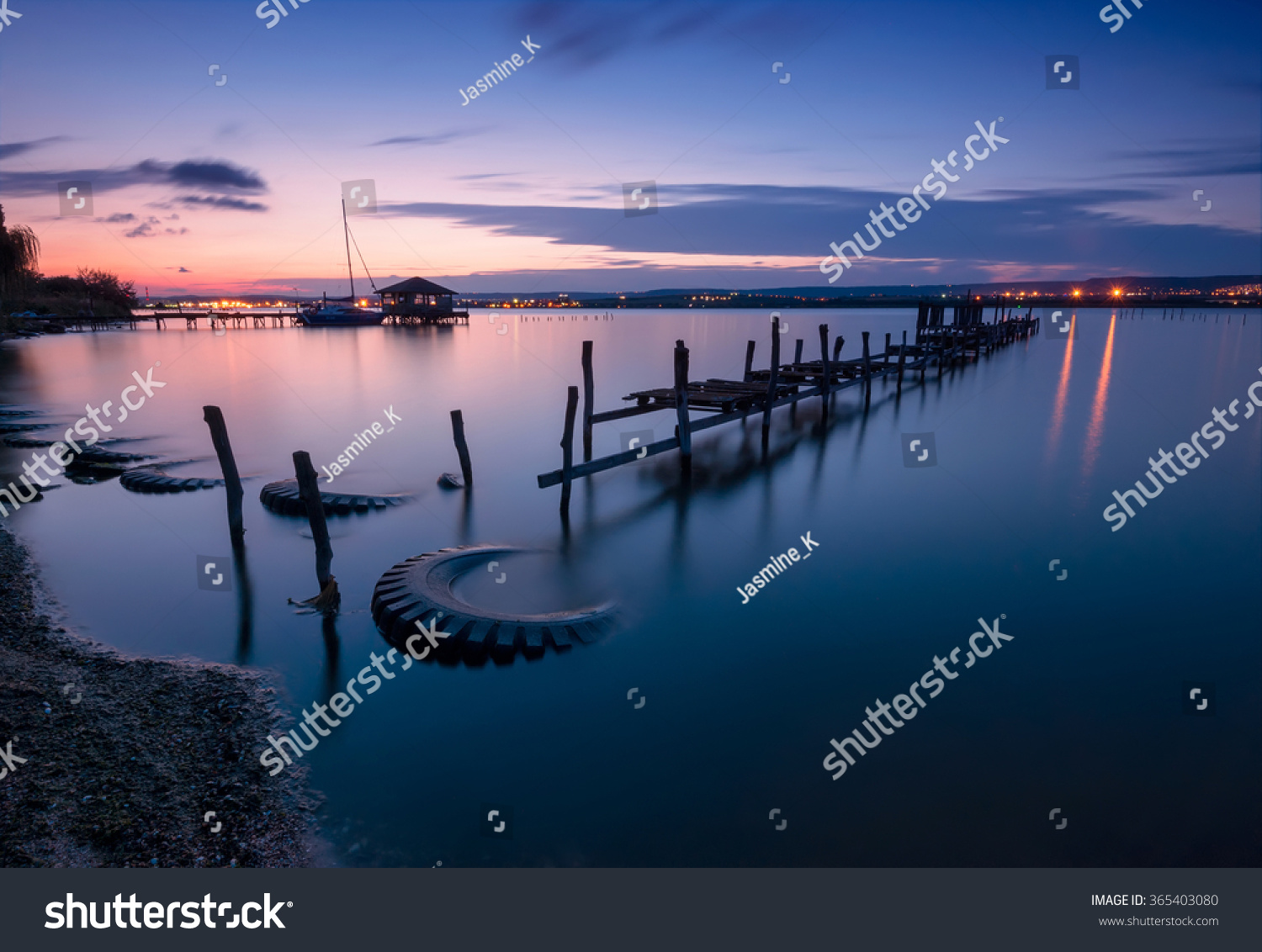 Blue silence. Magnificent long exposure landscape with lake view after sunset.