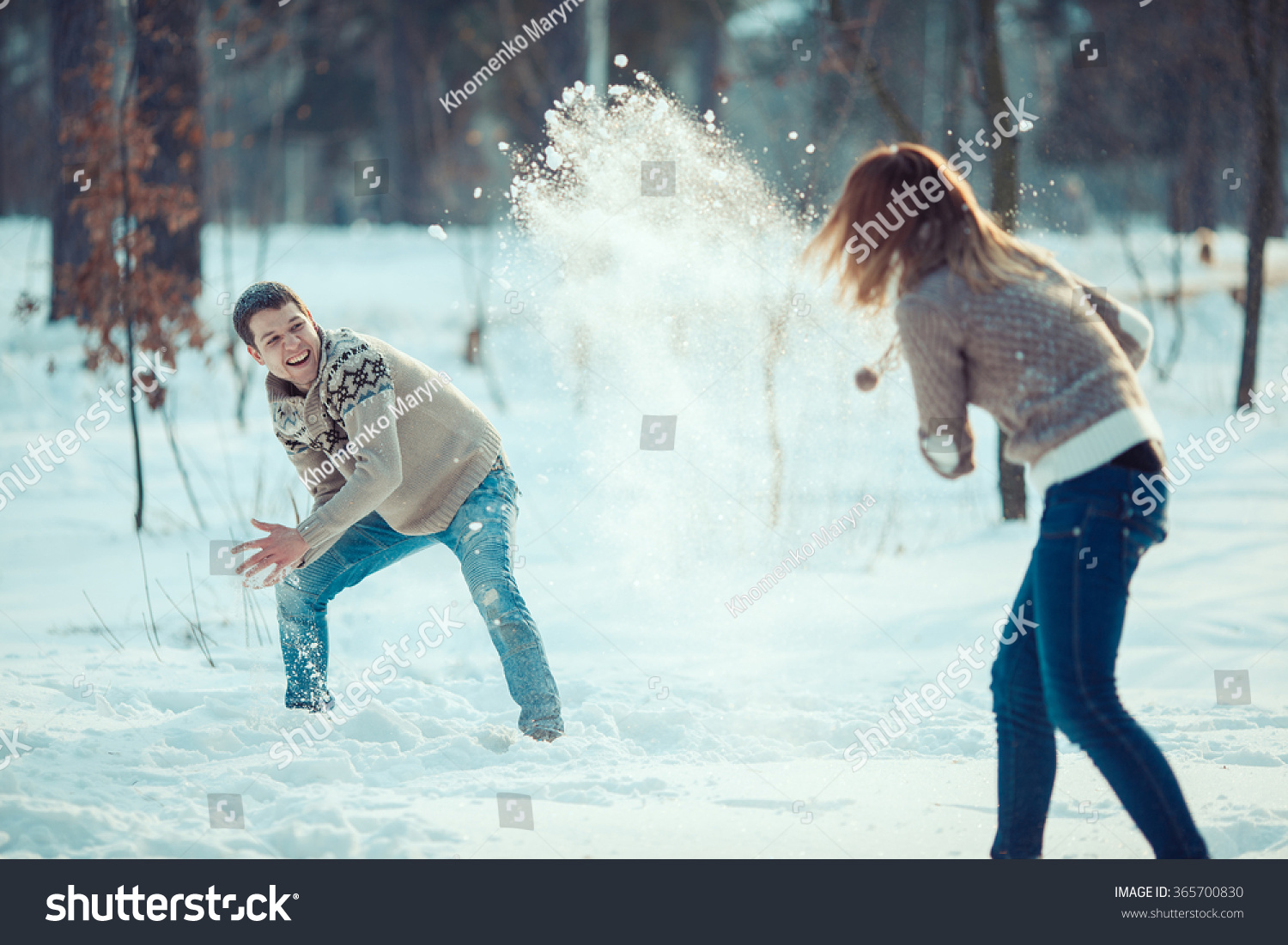 Couple playing snowball