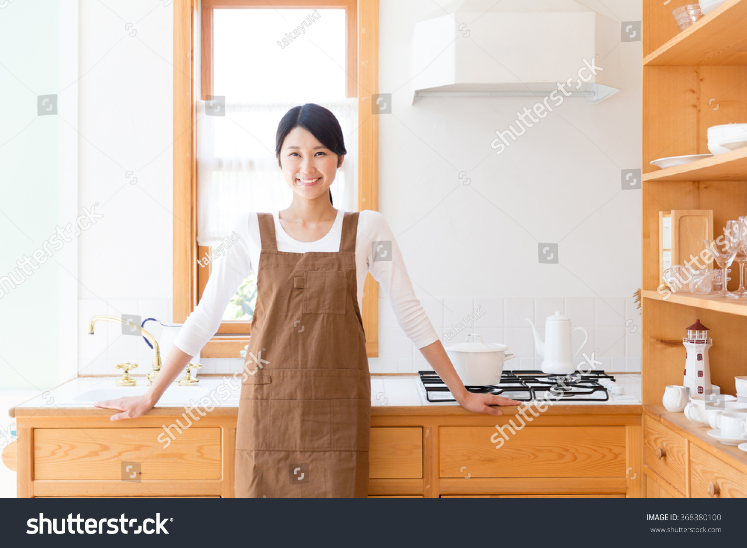 young asian woman in the kitchen