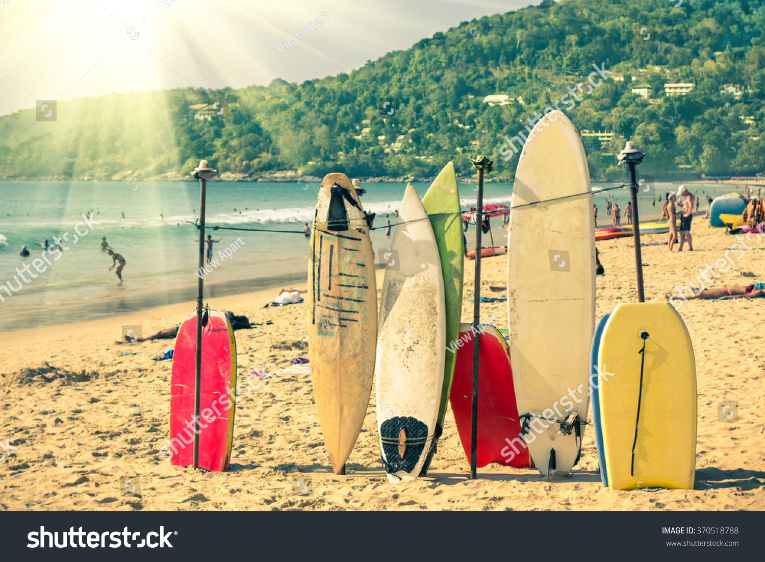 Multicolored surfboards at  Kata Beach in Phuket Island - Surf boards at tropical exclusive destination in south east Asia - Wonders of Thailand on vintage filtered look with enhanced sunshine