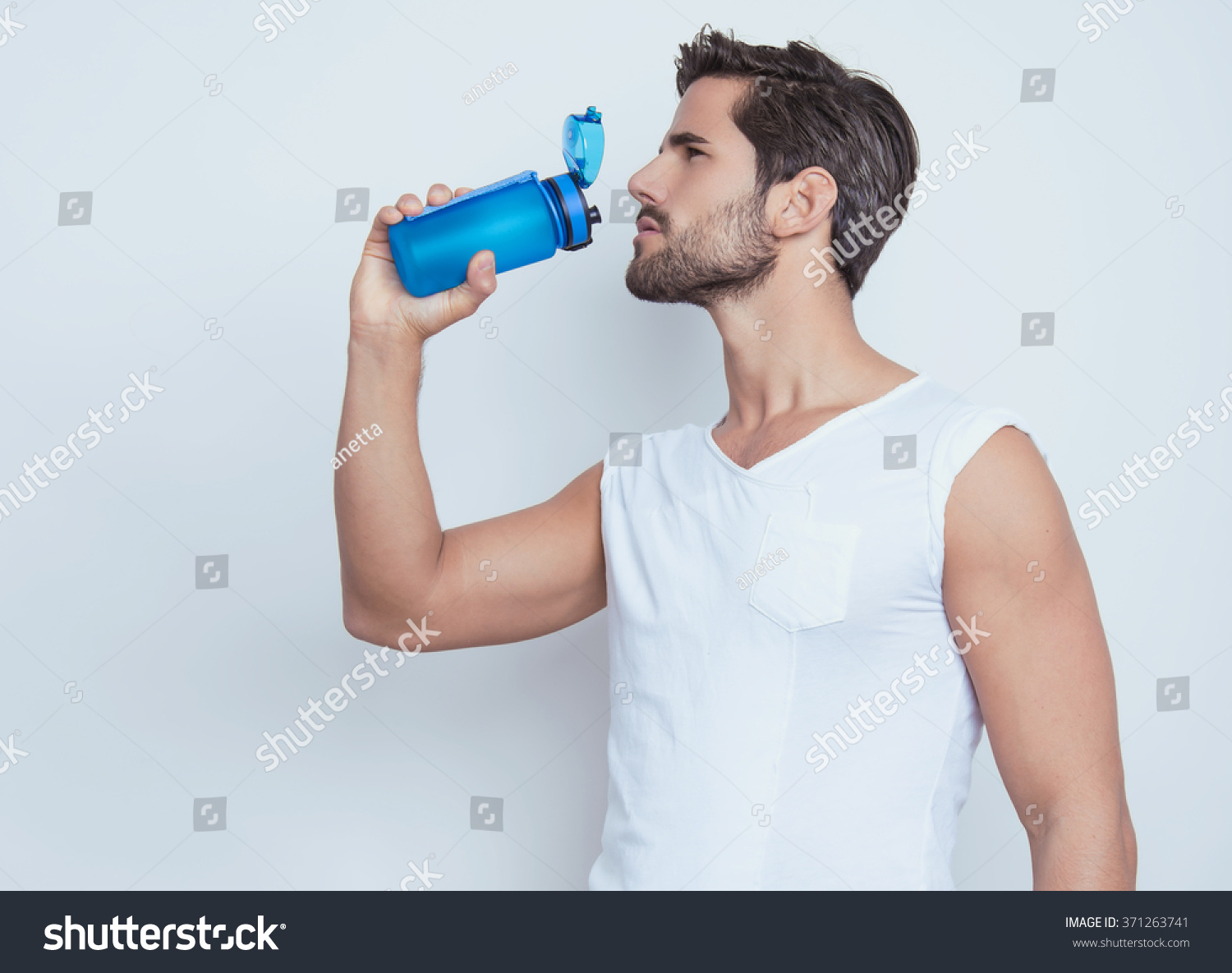 handsome young and fit man in workout clothes